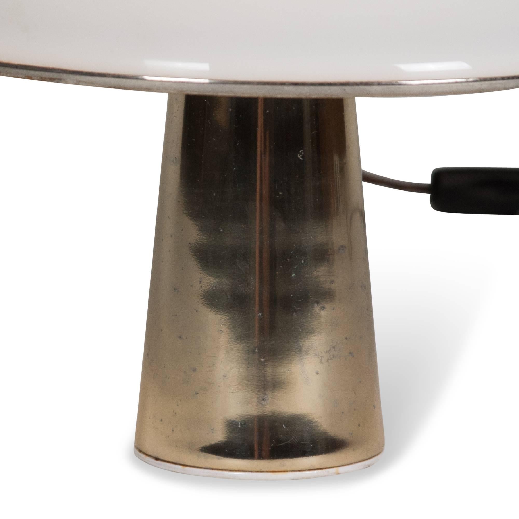 Frosted plexi cone shaped lamp, on slightly tapered lacquered gold tinted metal column base. By Guzzini, Italian, 1970s. Overall height 12 in, diameter of shade 11 1/2 in. (Item #2352).