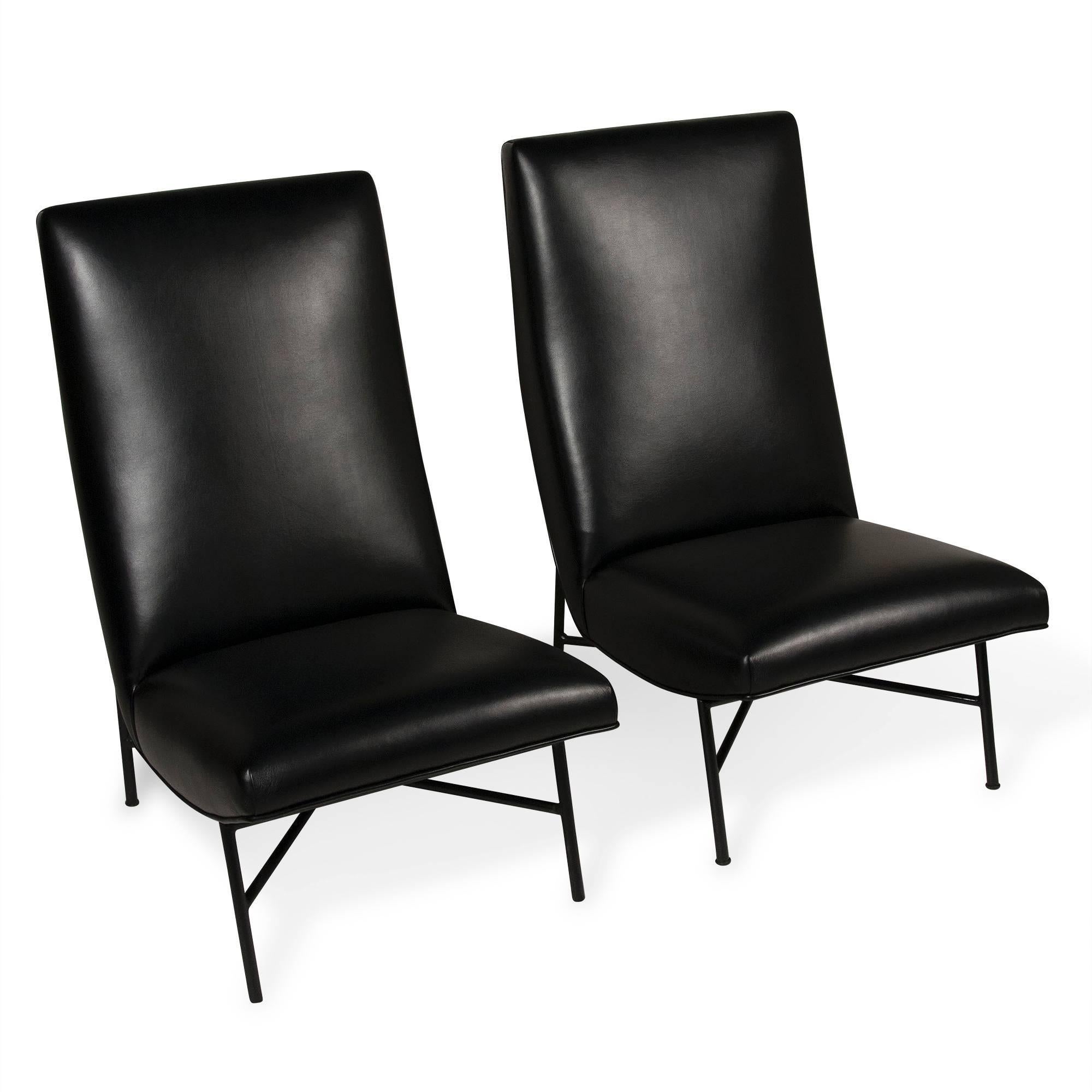 Pair of high back iron frame chairs, four legs with crossed stretcher support, by Dangles and Defrance for Burov Editions, French, circa 1955. Newly upholstered in high quality black vinyl. Back height 36 in, seat height in front 12 in, depth 19