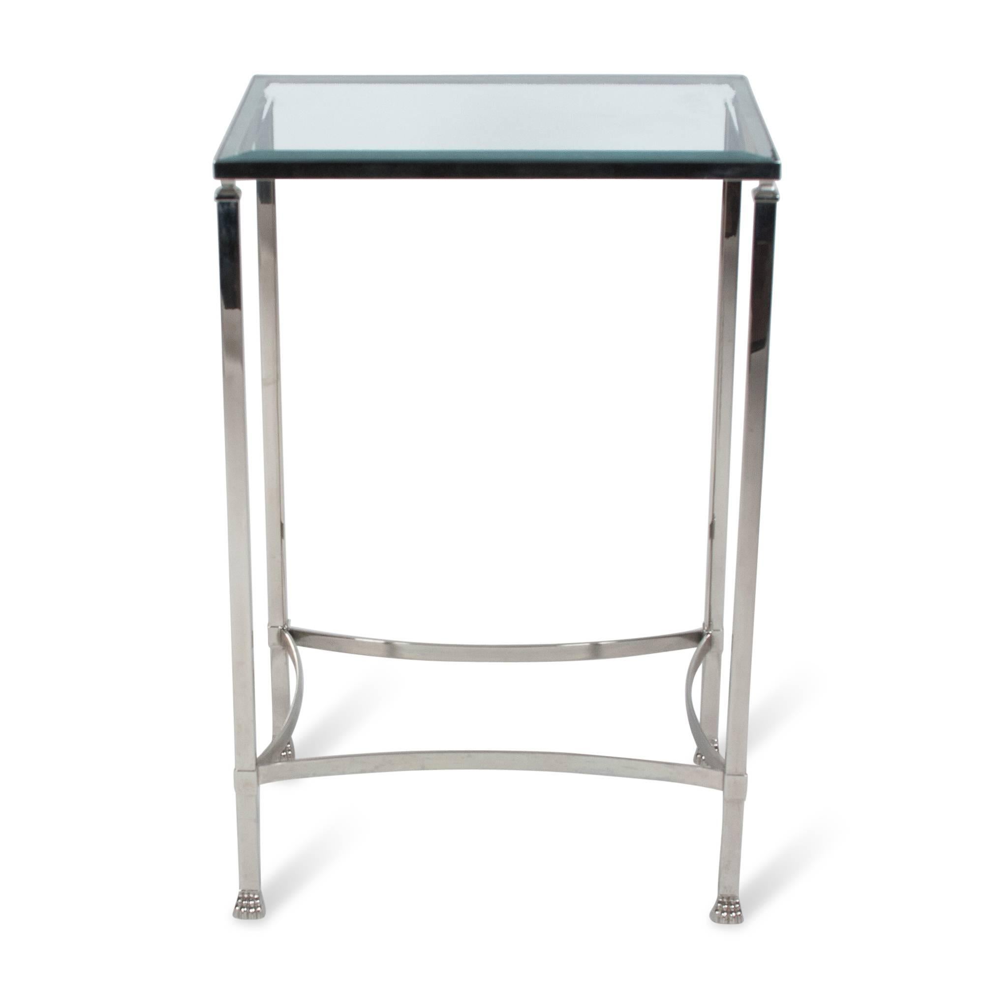 Stainless steel rectangular glass top side table, beveled glass, paw feet, by Philippe Starck, France 1980s. Measures: 33 1/4 in H, 22 in W x 16 in D.