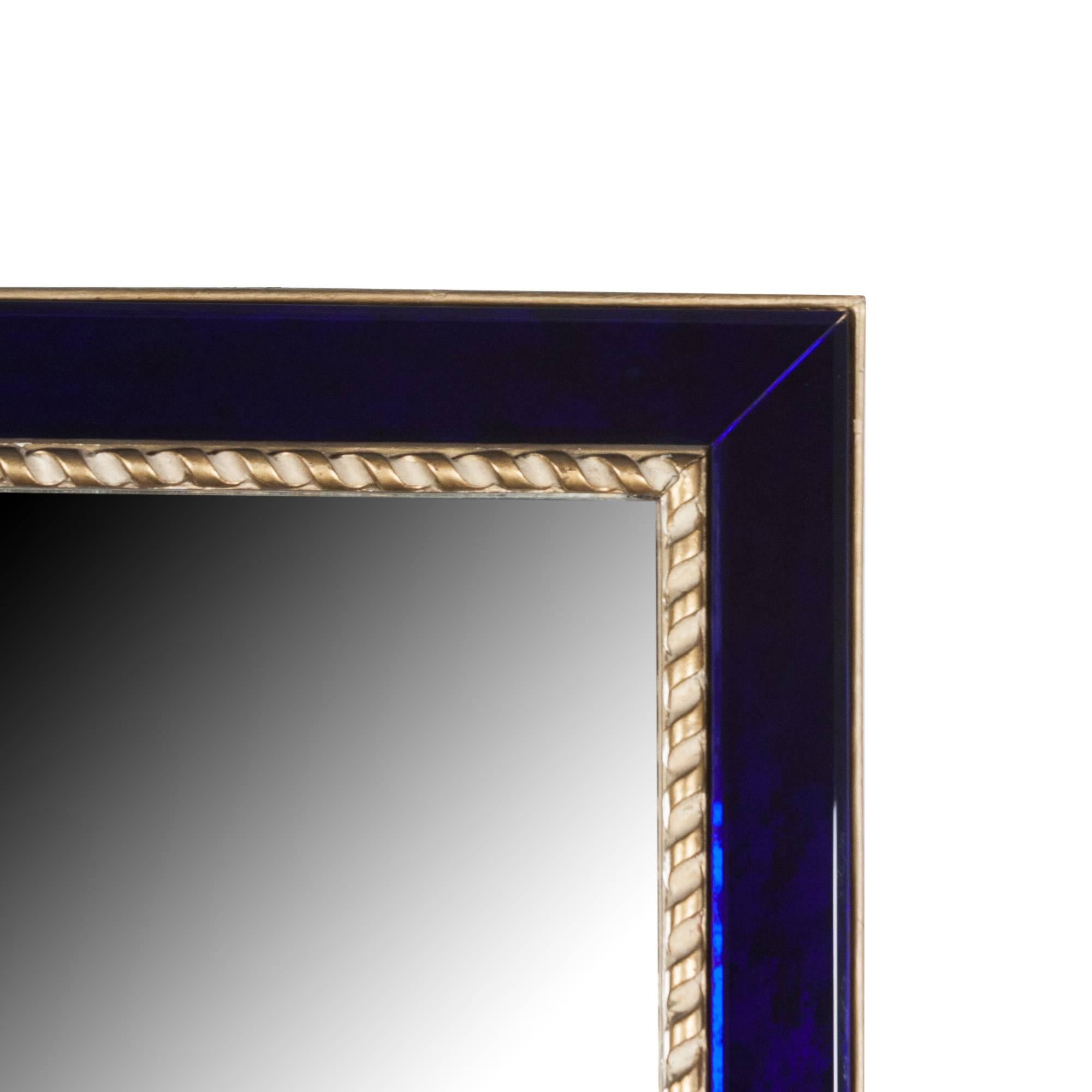 Rectangular wall mirror with blue glass frame, giltwood outer frame, and inner frame of rope twist form giltwood, attributed to Pierre Lardin, France, 1940s. Measures: Height 23 1/2 in, width 20 in, depth 1 in.