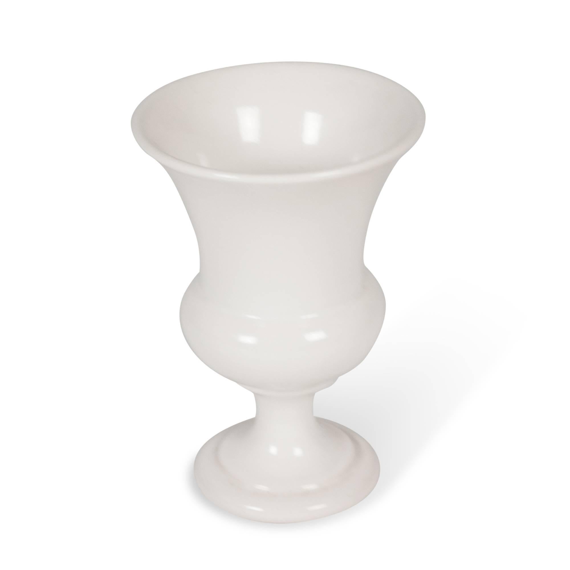 White ceramic urn form vase, tapered open body on foot, by Pol Chambost, France, circa 1950. Signed to underside. Measures: Height 7 3/4 in, diameter of opening 5 in, diameter of base 3 1/2 in.