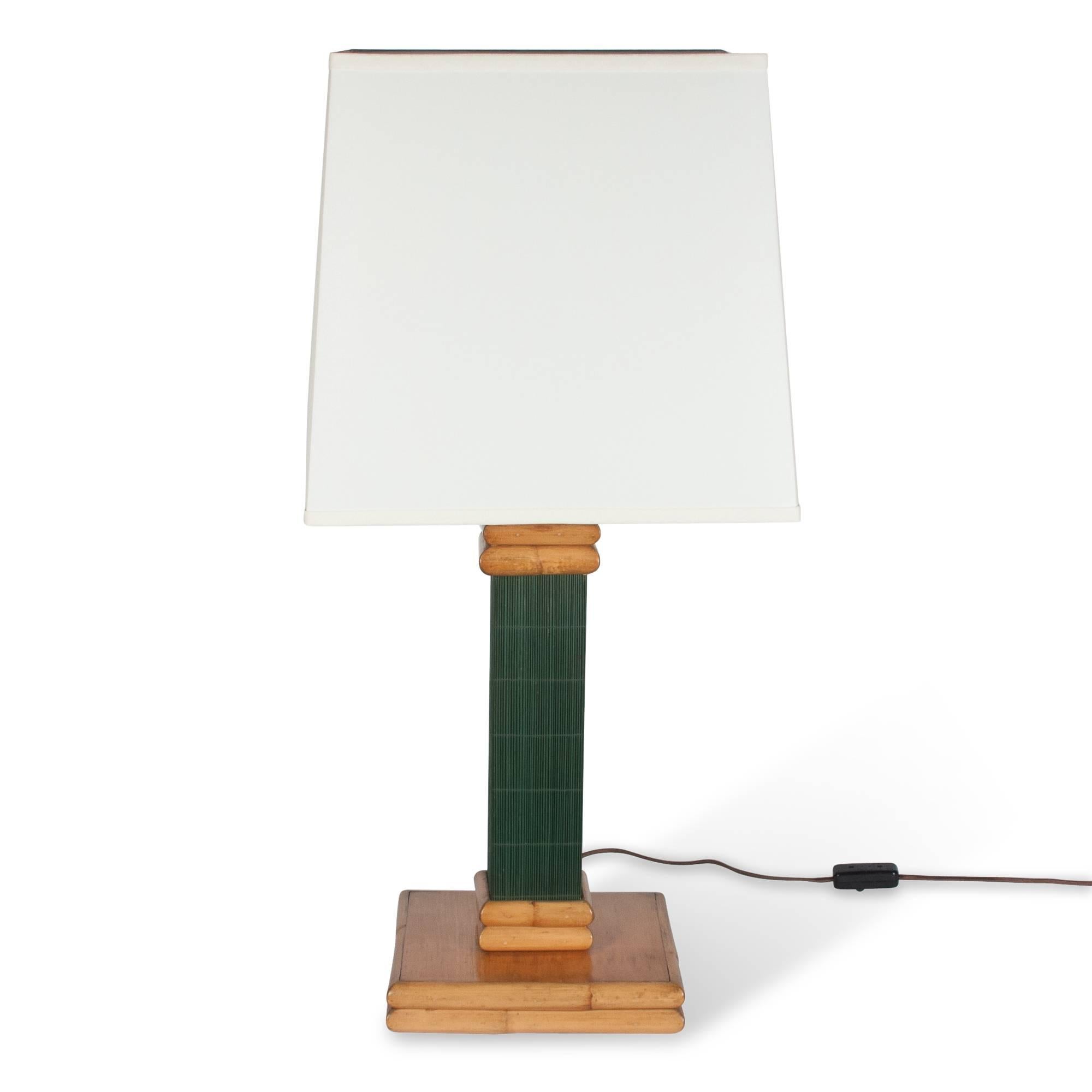 Pair of bamboo and dyed bamboo table lamps, the green dyed central column resting on a natural color square bamboo base, United States 1950s. In custom linen shades. Measures: Overall height 32 in, base measures 9 3/4 in square, column is 4 in