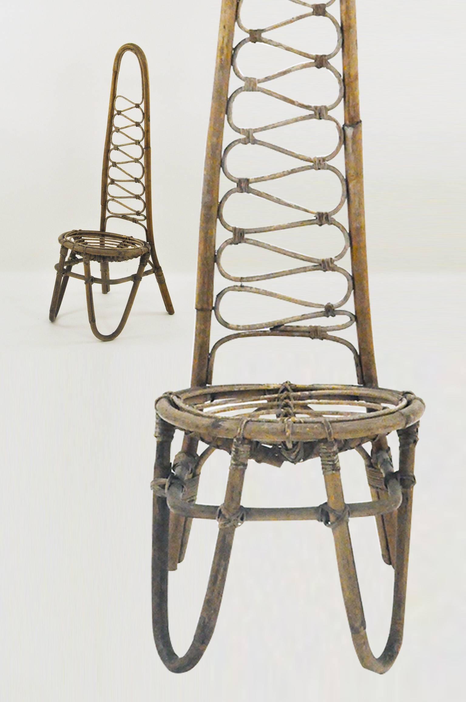 French Rattan pair of chairs in the style of Jean Royère.

 