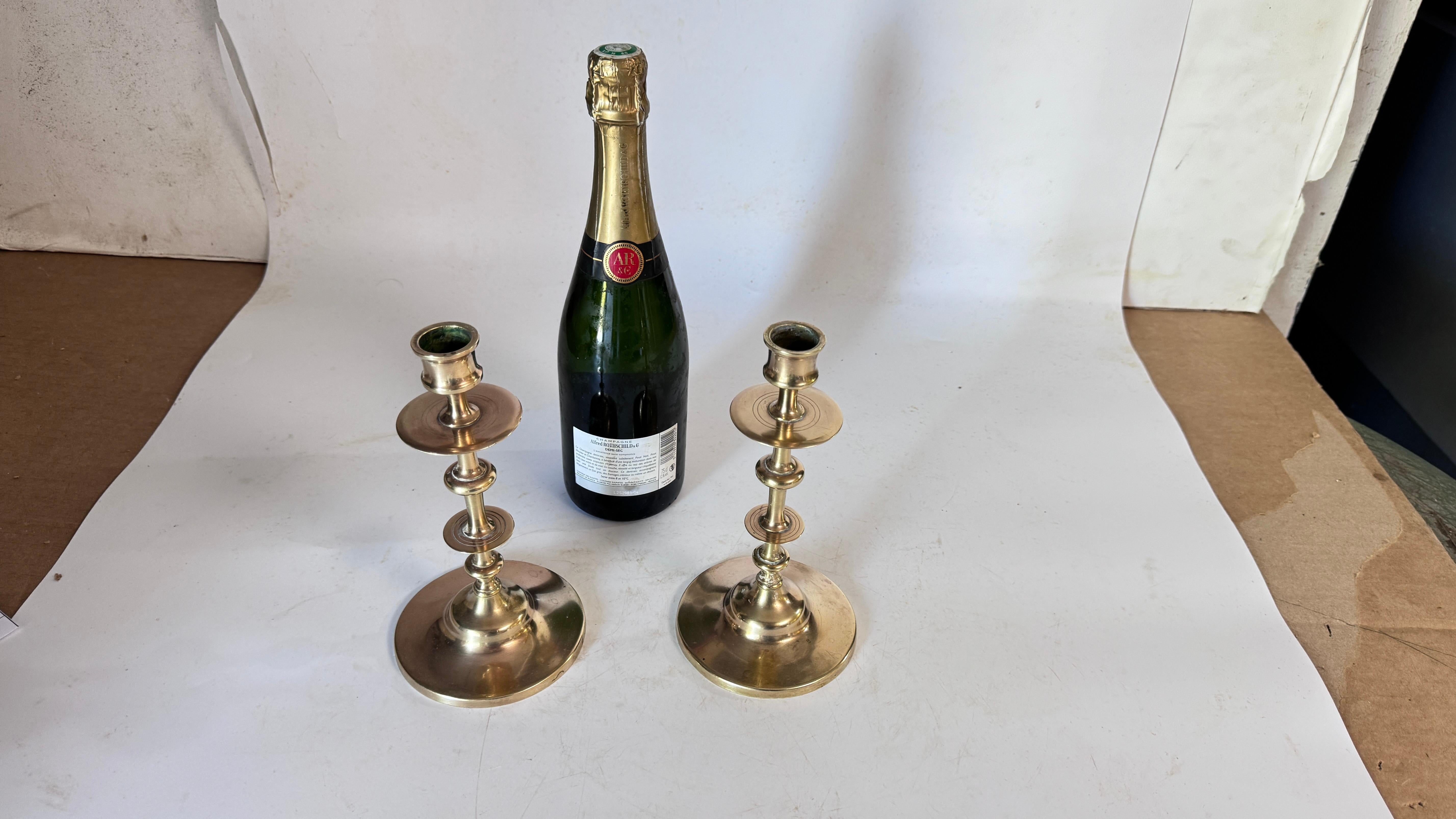 Pair of 19th Century French Solid Brass Candlesticks – Minimalist Design – Antique Patina

Description:
This is a pair of solid brass candlesticks, handcrafted in France during the 19th century. With a simple, elegant design, each candlestick
