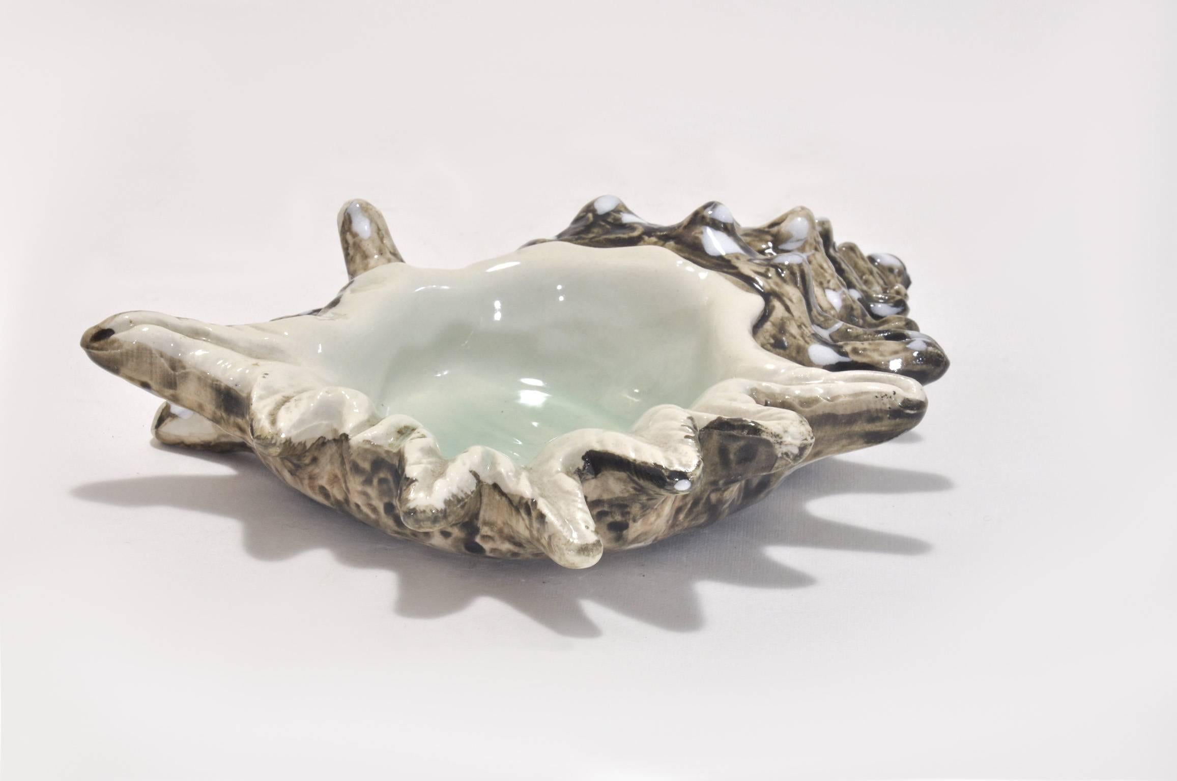 Beautiful ceramic shell ashtray, the finish is a nacre style finish.