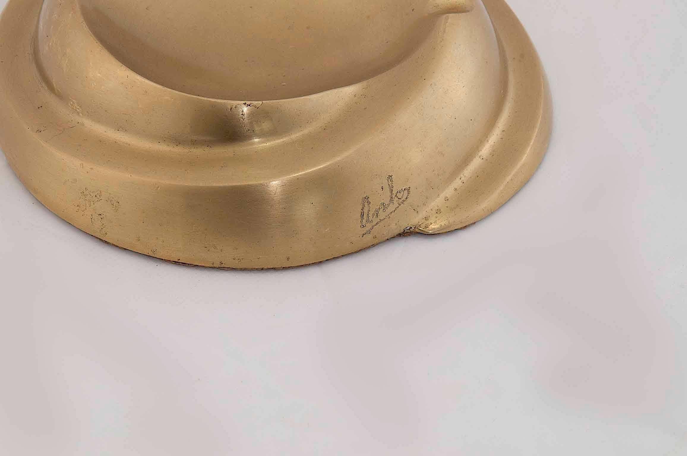 1960 solid brass ashtray, signed.
Brass sculpture, Vide Poche, decorative object.