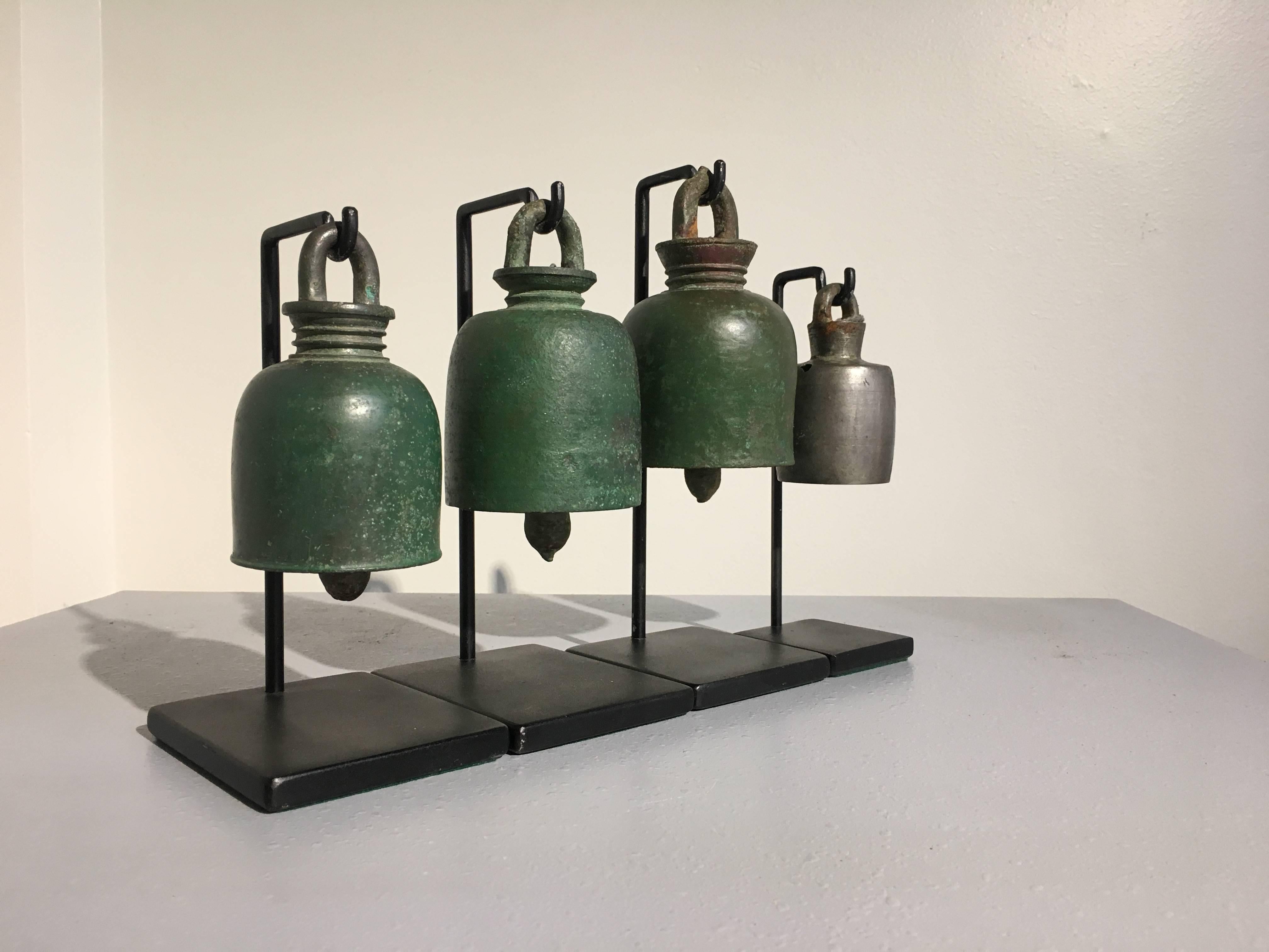 A set of four elephant bells, three in bronze, and one in silver, created during the Khmer Empire, during the Angkor Wat Period, circa 12th-14th century in modern day Cambodia.
Of Classic shape, each one displaying a gorgeous and unique patina. All