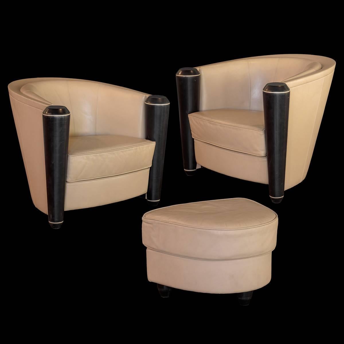 Wonderful pair of cream and black color Italian leather club chairs and an ottoman. Designed by Adam Tihany, an American architect for Pace collection and manufactured by 14 Mariani, circa 1980s.
 