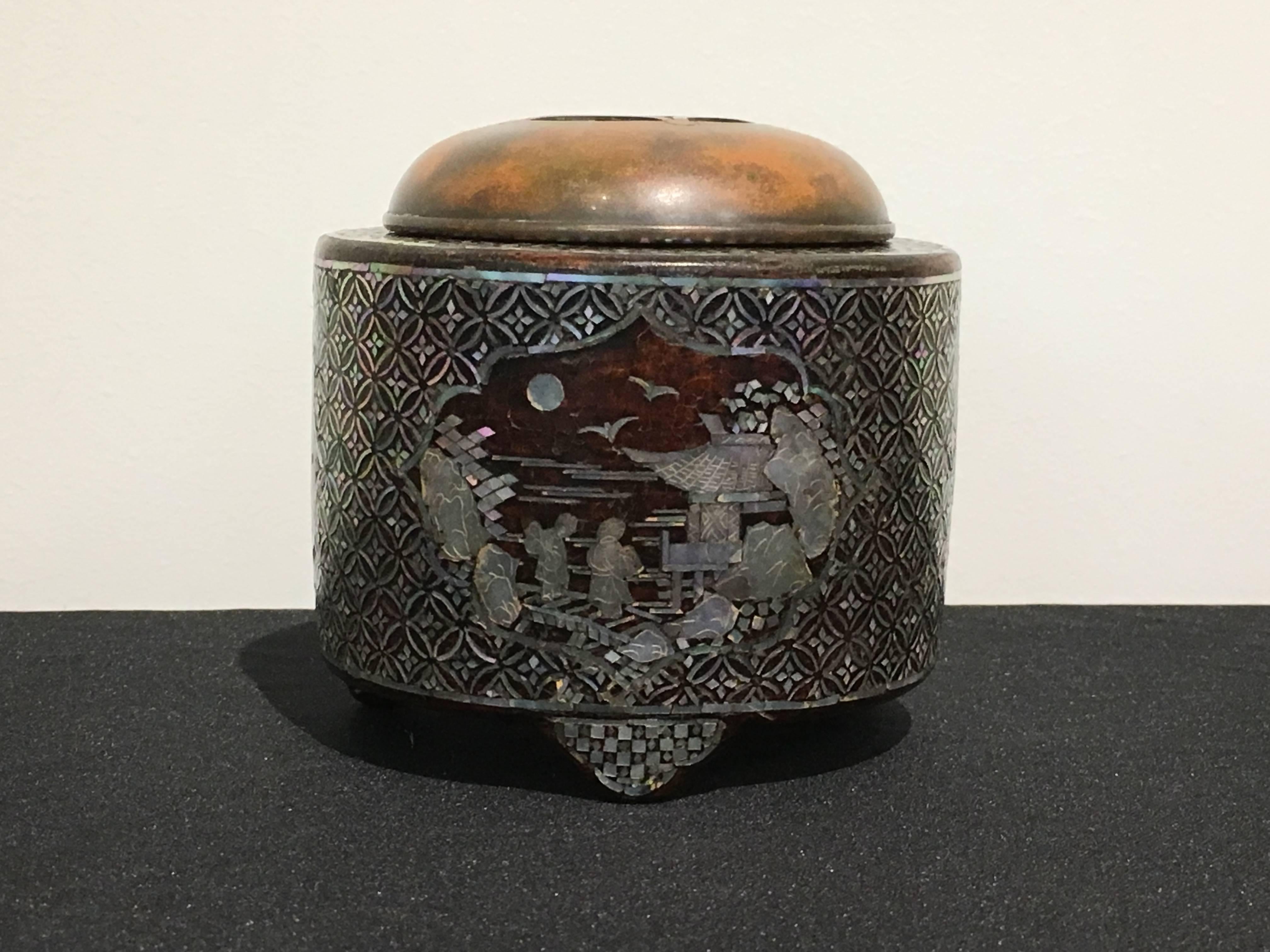 A highly unusual Japanese crackle glazed koro (incense burner or censer), lacquered and inlaid with mother-of-pearl embellishment, signed Gyokusen, Edo Period, early to mid 19th century, Japan.

The crackle glazed stoneware body of cylindrical form