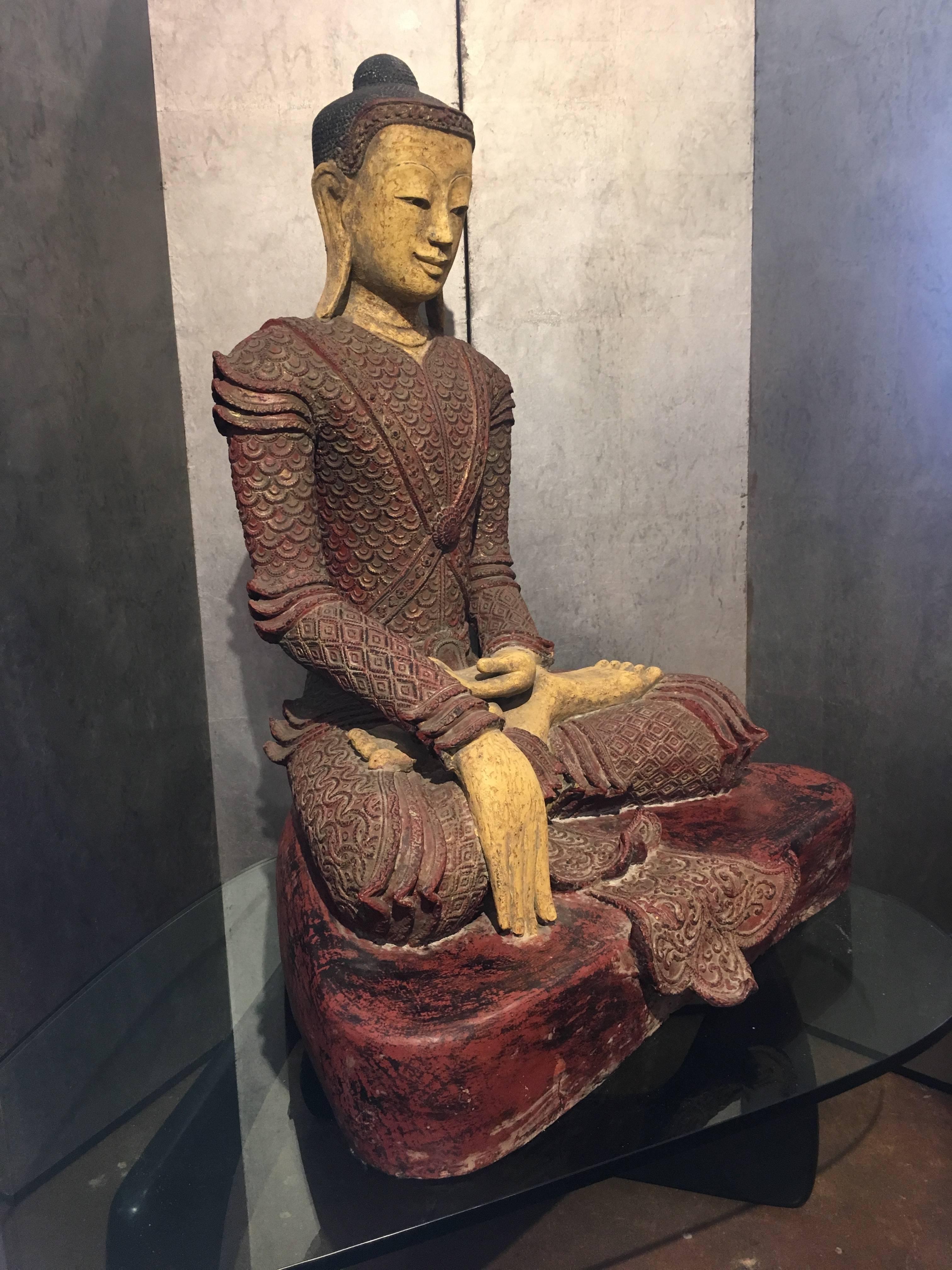 An outstanding lifesize early 20th century Shan Burmese dry lacquer figure of the Buddha dressed in royal attire.
The royal Buddha sits upon a raised platform is vajrasana, hands in bhumiprasha mudra, calling the earth to witness his enlightenment.
