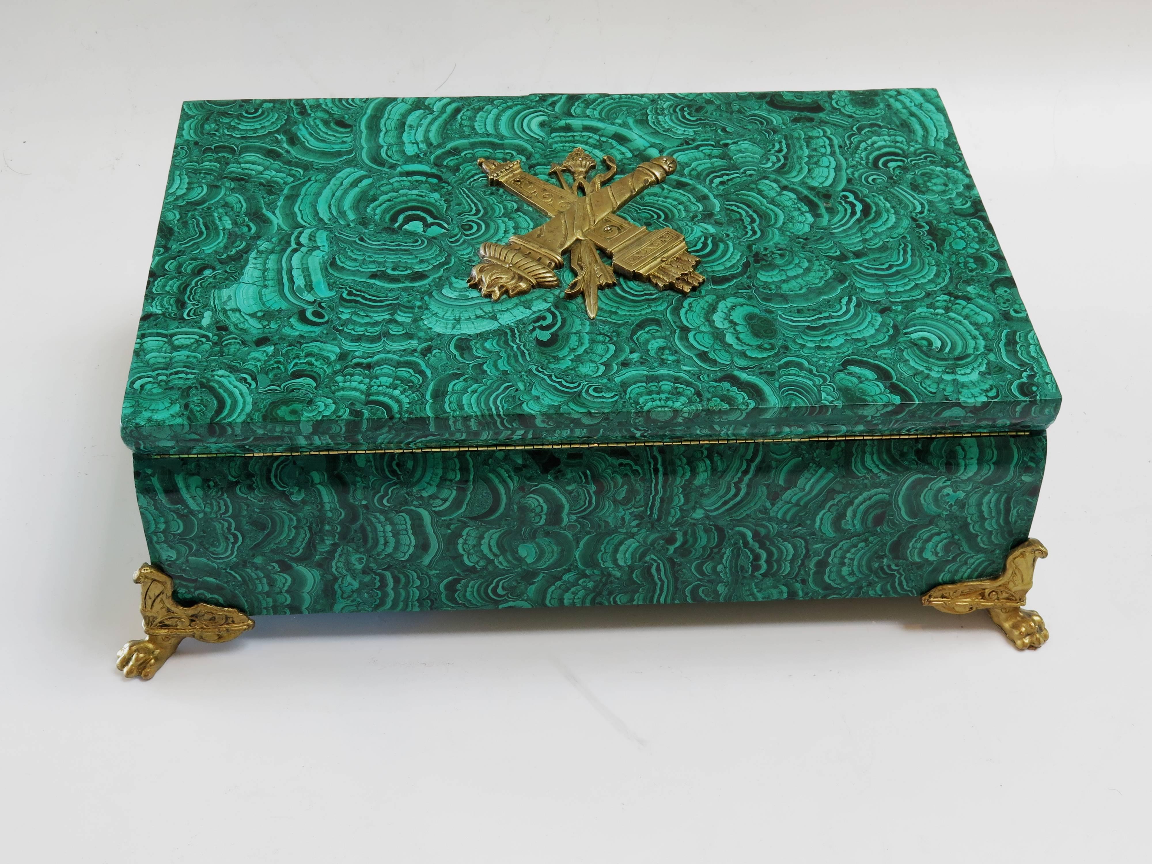 This is a hinged Russian large gilt bronze mounted solid malachite box. Heavy in weight.
   