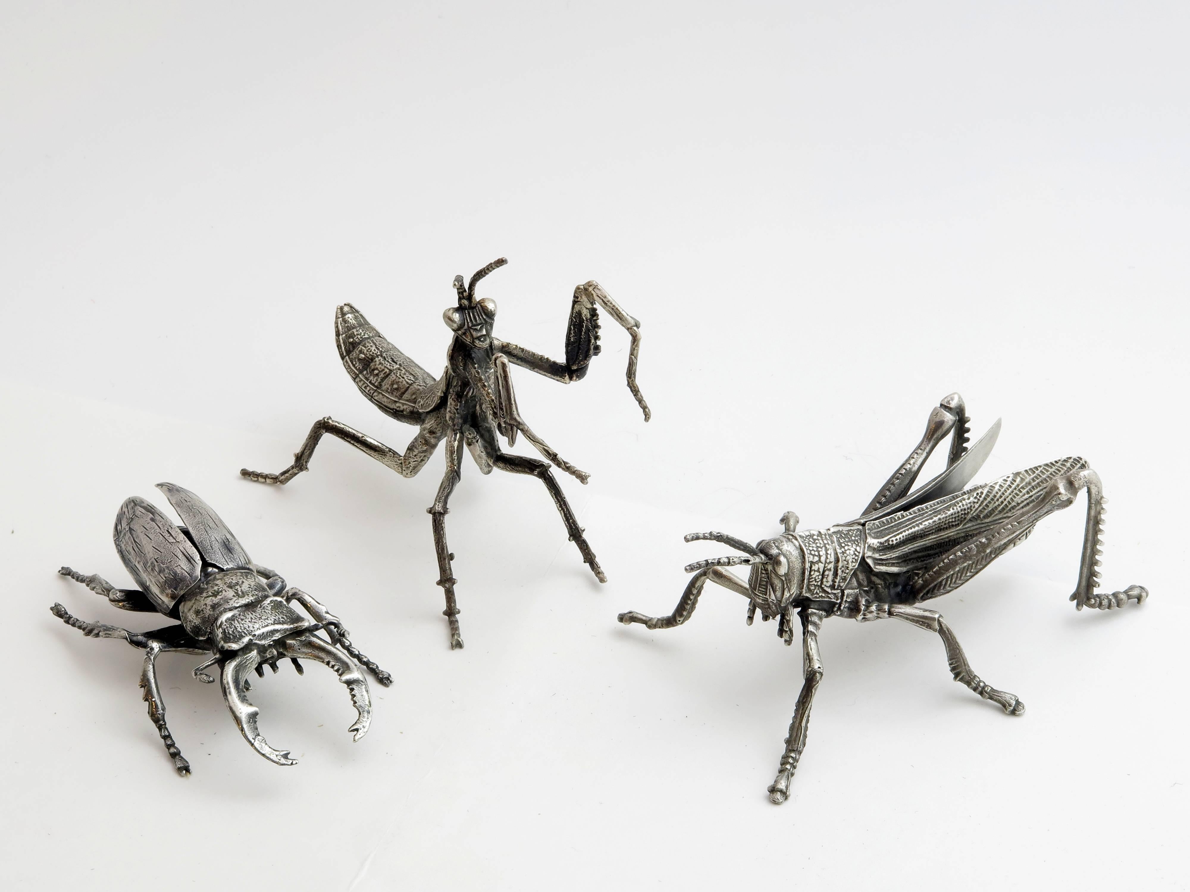 A collection of wonderfully details three whimsical sterling silver bugs. Beetle, dancing mantis and grass hopper. All marked 