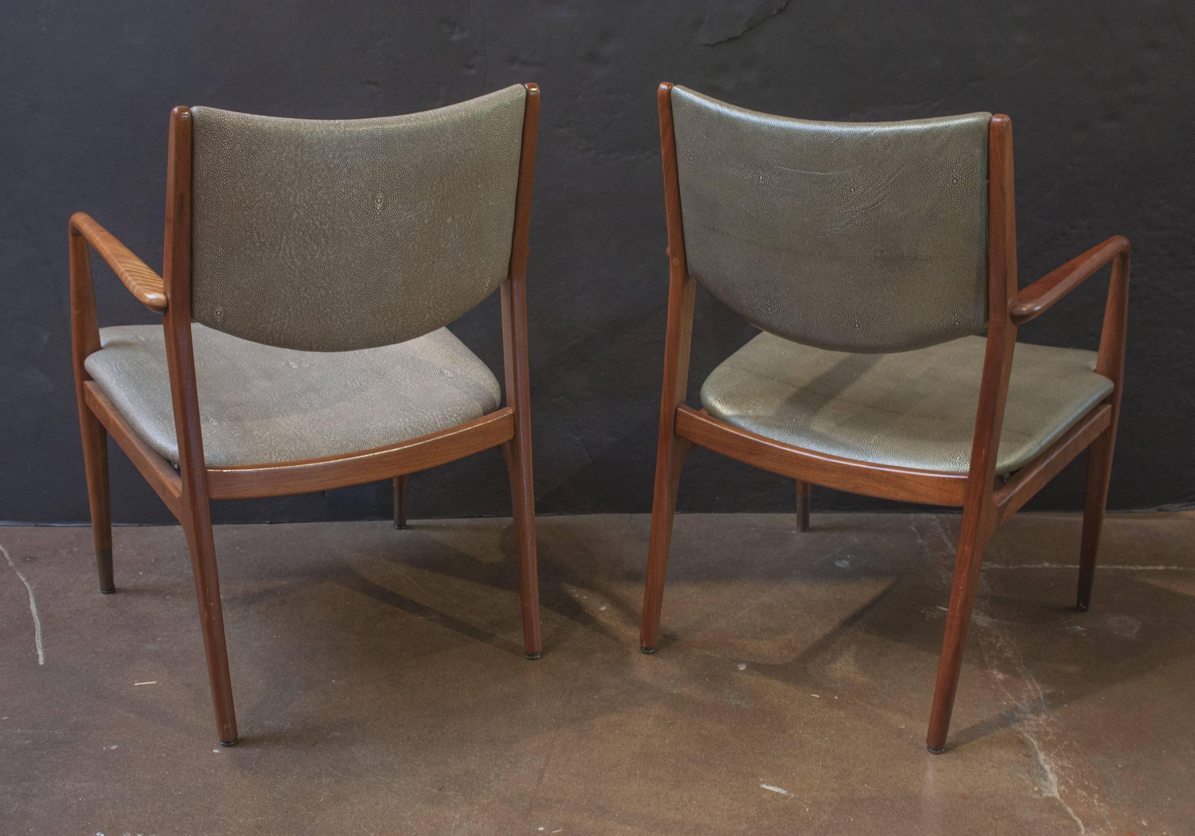 A handsome and solid pair of Mid-Century Modern walnut armchairs designed by George Reinoehl for Stow Davis, Grand Rapids, MI. The clean lines and minimalist design invoking the beauty of Scandinavian modernism, while the durable construction speaks