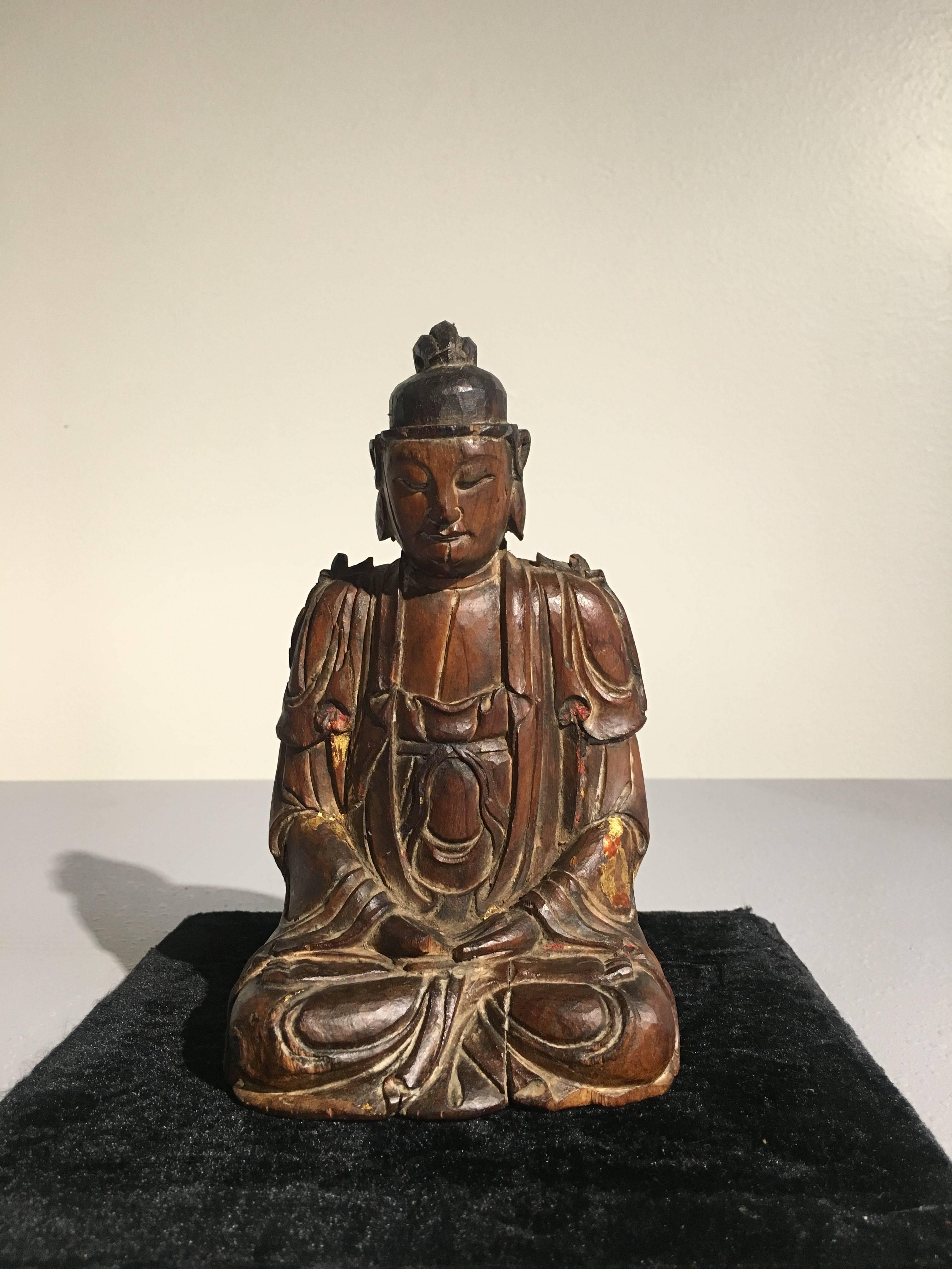 A small and very fine Chinese carved sandalwood figure of a bodhisattva, possibly Avalokiteshvara (Guan Yin), Song Dynasty (960 to 1276), circa 13th century, China.

Carved from a single piece of fragrant sandalwood, the enlightened being is