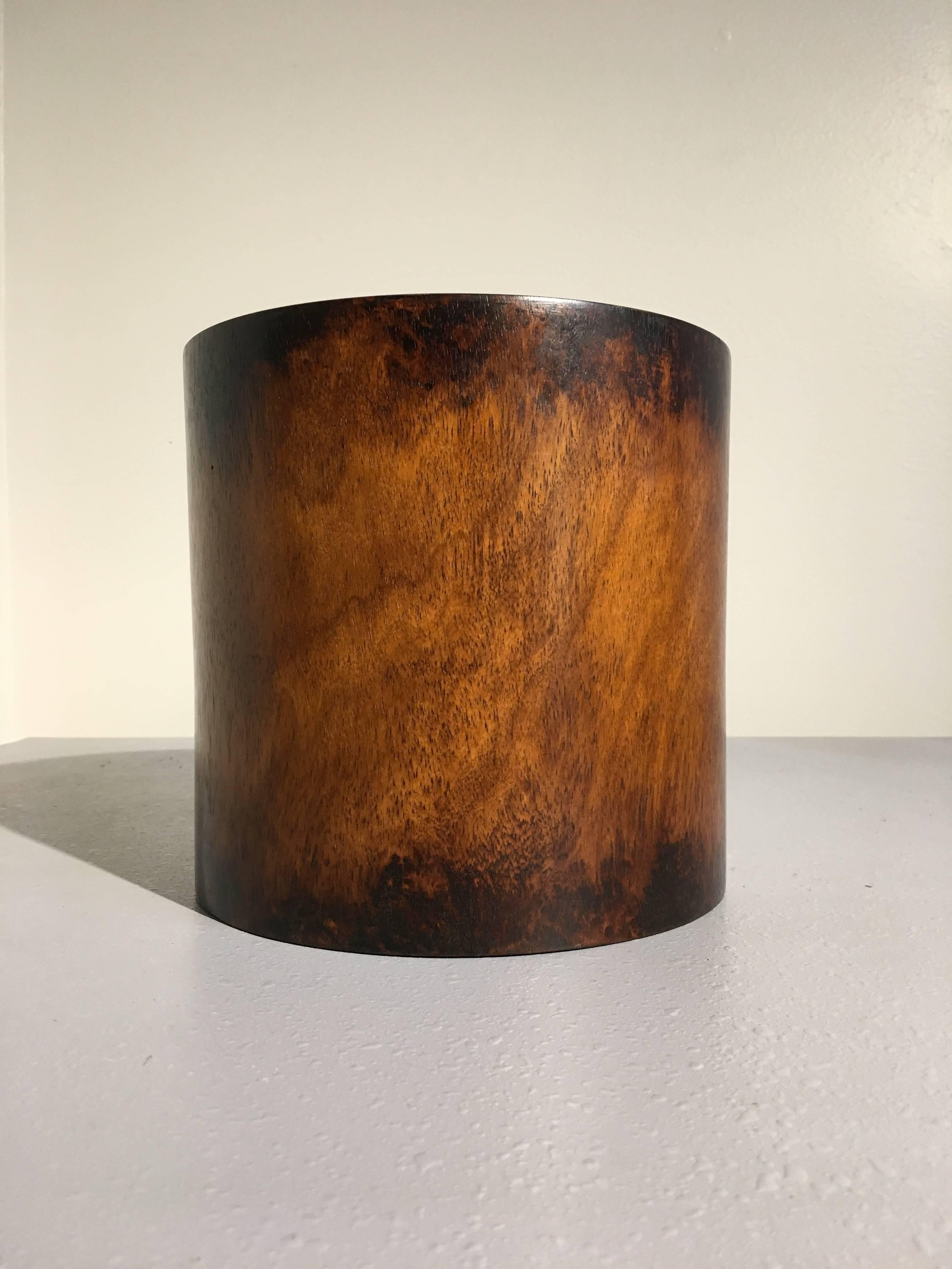 A large 19th century Qing dynasty huanghulai brush pot. 
Of simple cylindrical form. The wood displaying a lovely patina of rich honey brown, with an attractive, muted grain, reminiscent of landscapes. 
Used by scholars to hold their paint and