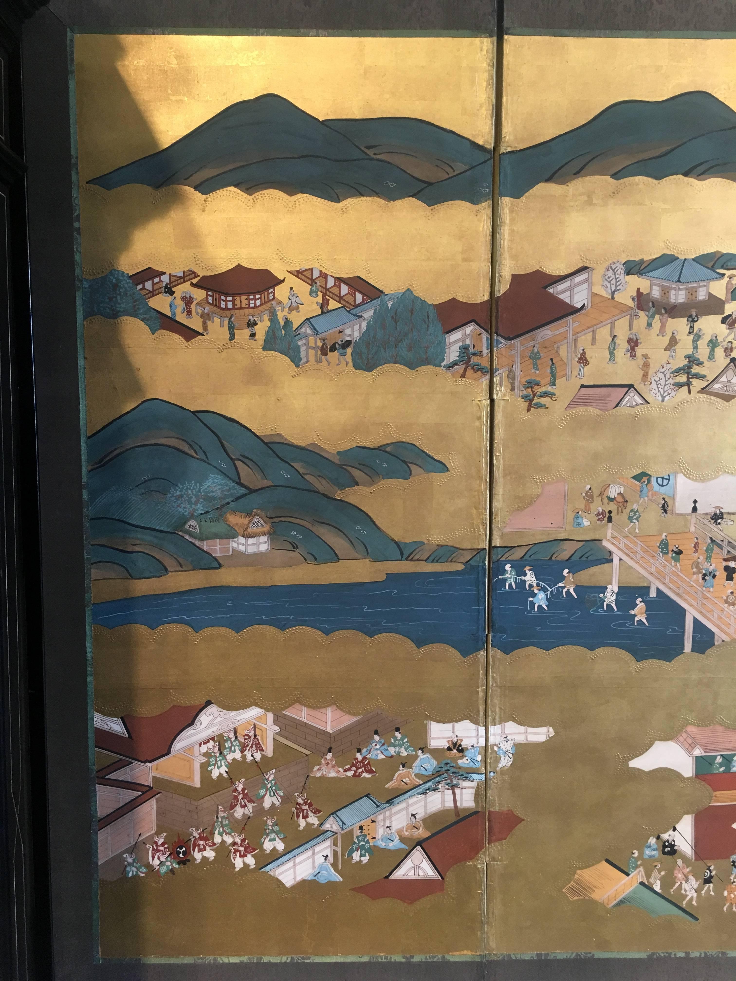 A fine Japanese Tosa School six fold painted paper screen, byobu.
Painted in bright mineral pigments, with large areas covered by a stunning gold leaf, evoking clouds kissed by the sun.
The scene depicted is of the Gion Matsuri, a yearly festival