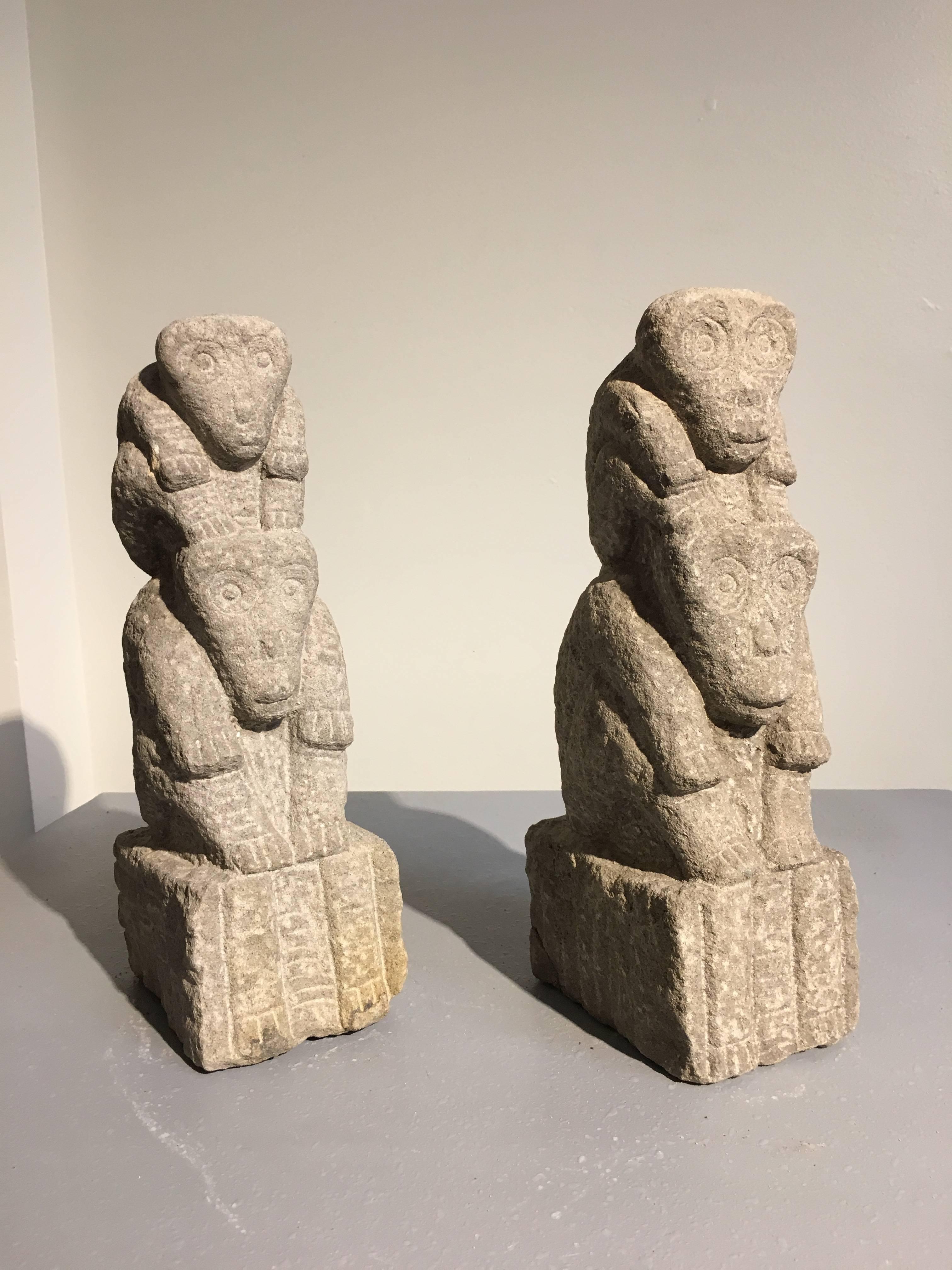 A pair of intriguing and delightful carved sandstone monkey totems from Yunnan, China.
Each TOTEM featuring two monkeys, a smaller monkey resting upon the back of a larger one. Portrayed sitting firmly on their haunches, with hands resting on their