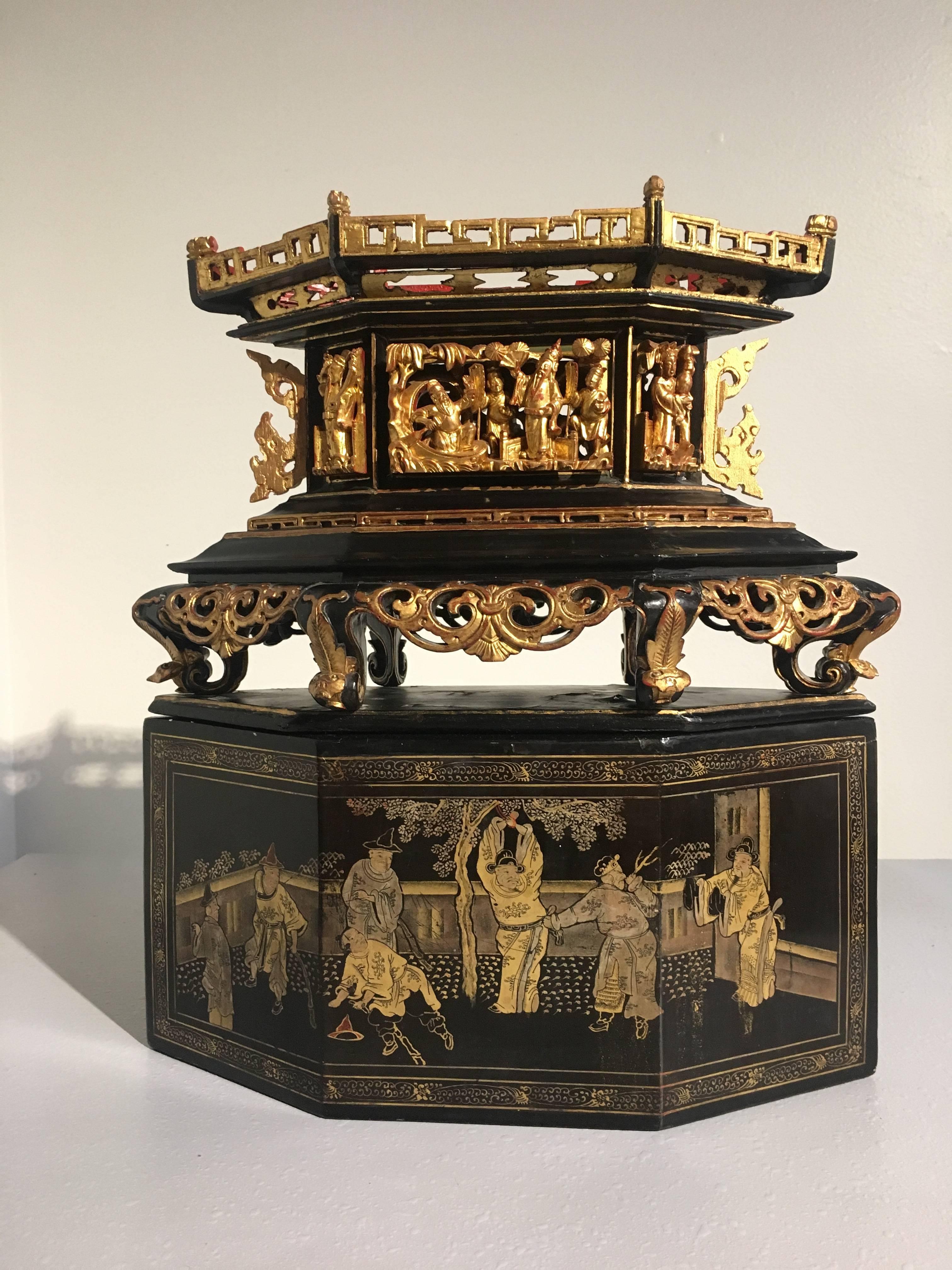 A fine Chinese lozenge shaped altar box made for use by the Peranakan (also called Straits Chinese) Community.
The altar carved and pierced with figural and floral scenes and richly gilt. The cover lacquered and finely gilt painted with a