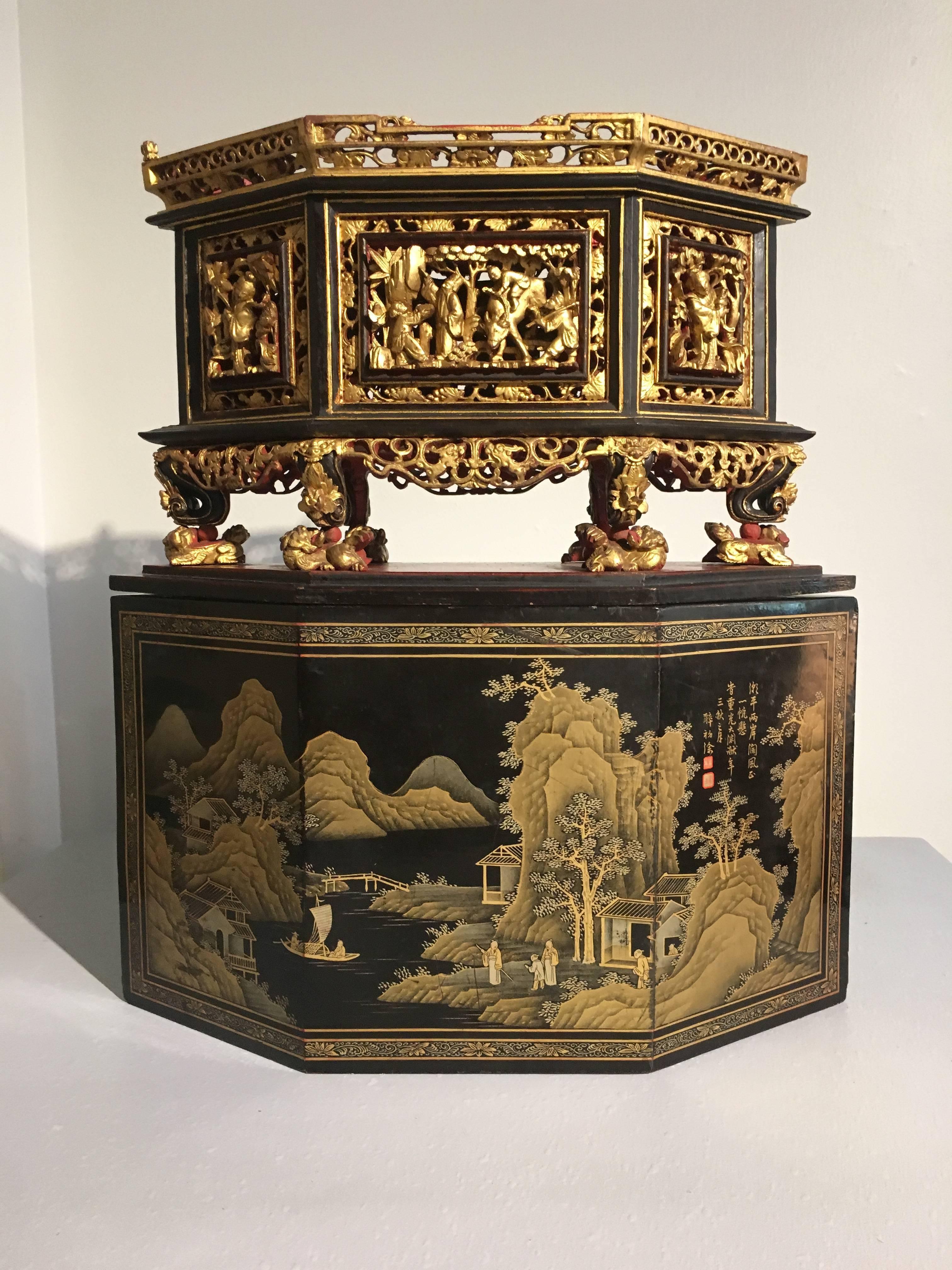 A large and fine Chinese lozenge shaped altar box made for use by the Peranakan (also called Straits Chinese) Community.
In two parts, the cover lacquered and finely gilt painted. One side featuring a court scene, the other an idyllic mountain and