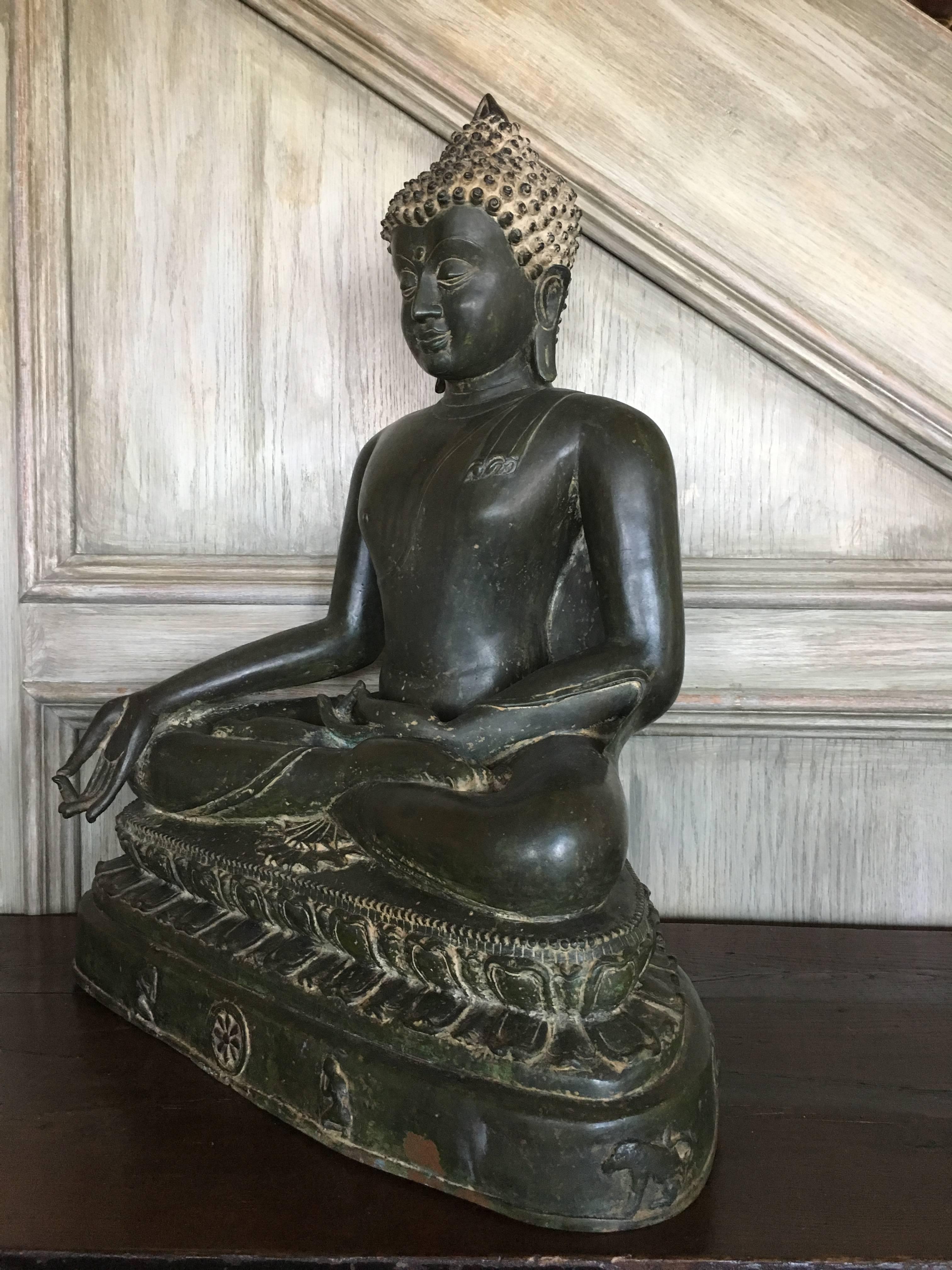 A large and magnificent cast bronze image of the Medicine Buddha, Bhaisajyaguru, rendered in the Burmese Pagan style, and most likely based on a period example that was either damaged or lost, 19th century, Burma or Thailand.  

He can be identified