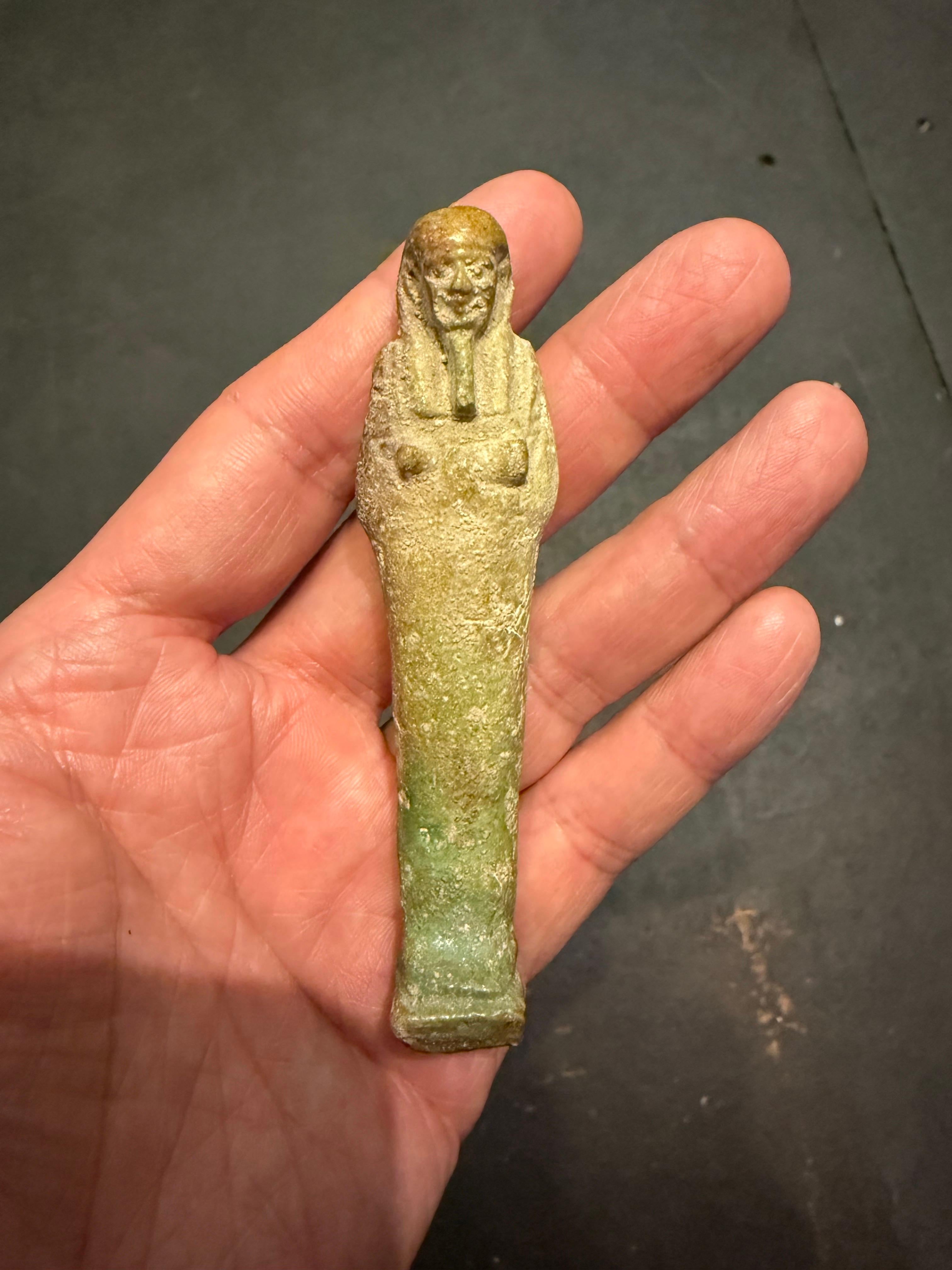 A modelled pale turquoise glazed Ushabti, Ex Sotheby's For Sale 1