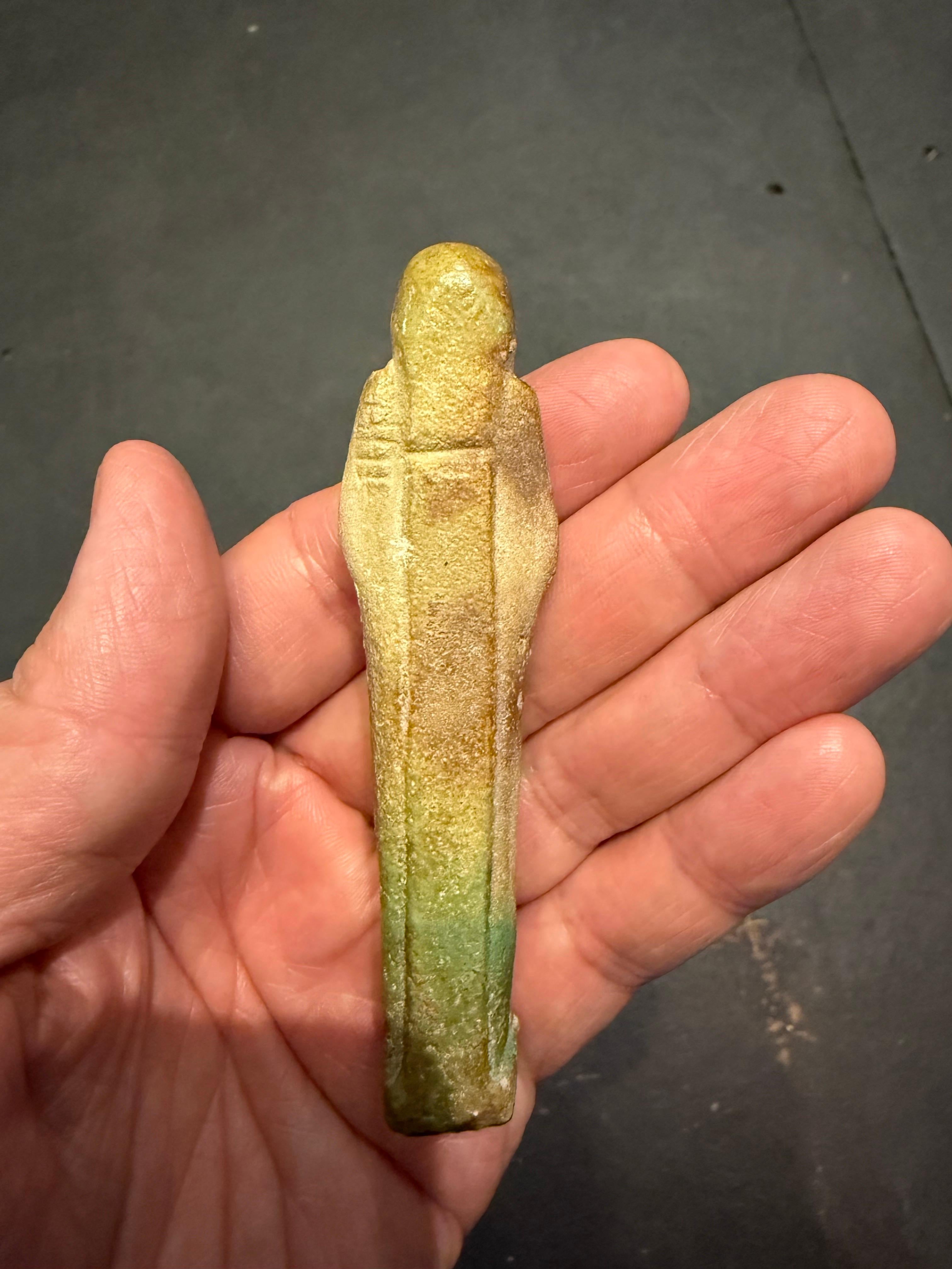 A modelled pale turquoise glazed Ushabti, Ex Sotheby's For Sale 9