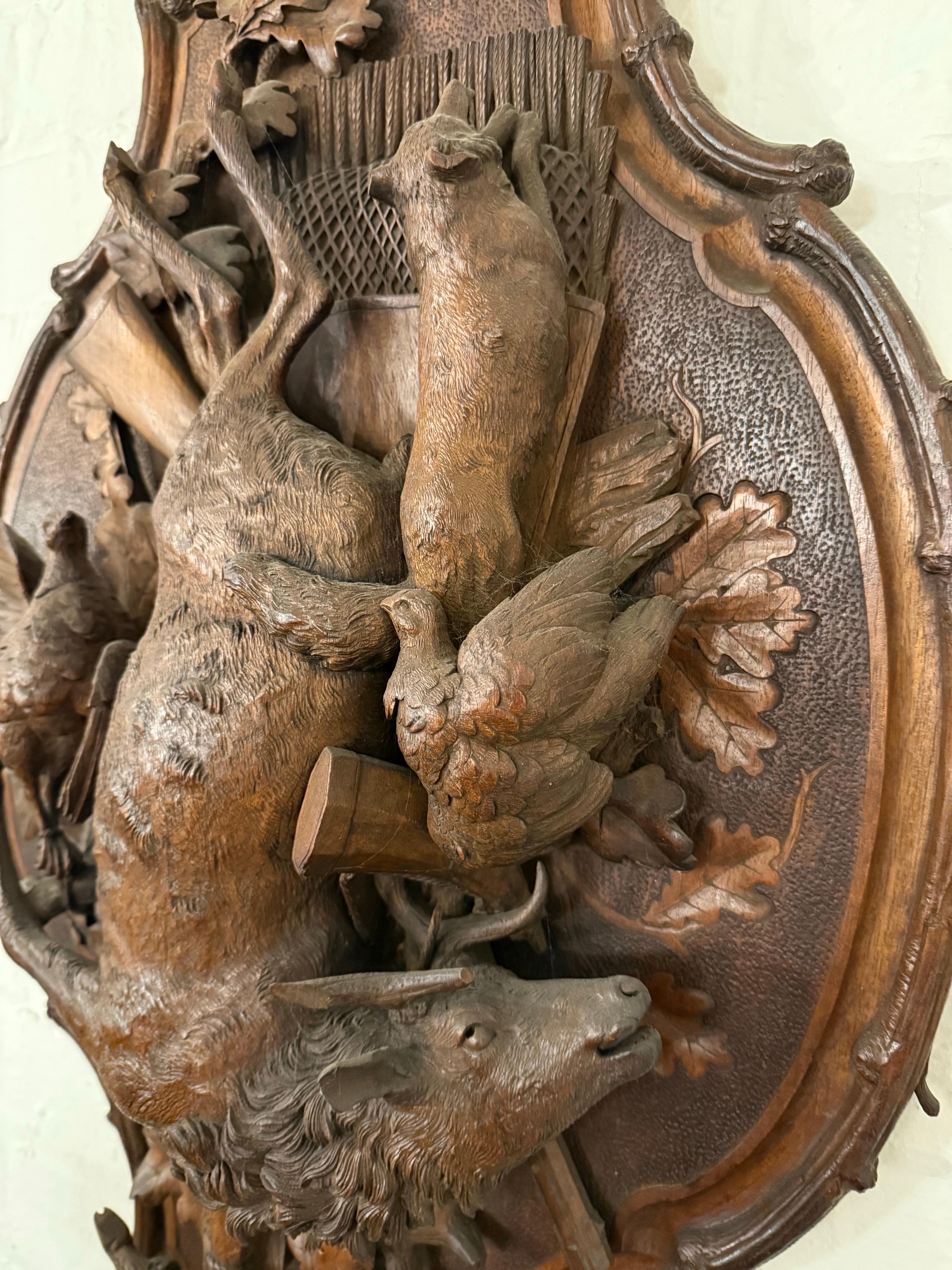 A Swiss Carved Black Forest Hunting Wall Plaque, Early 20th Century For Sale 4