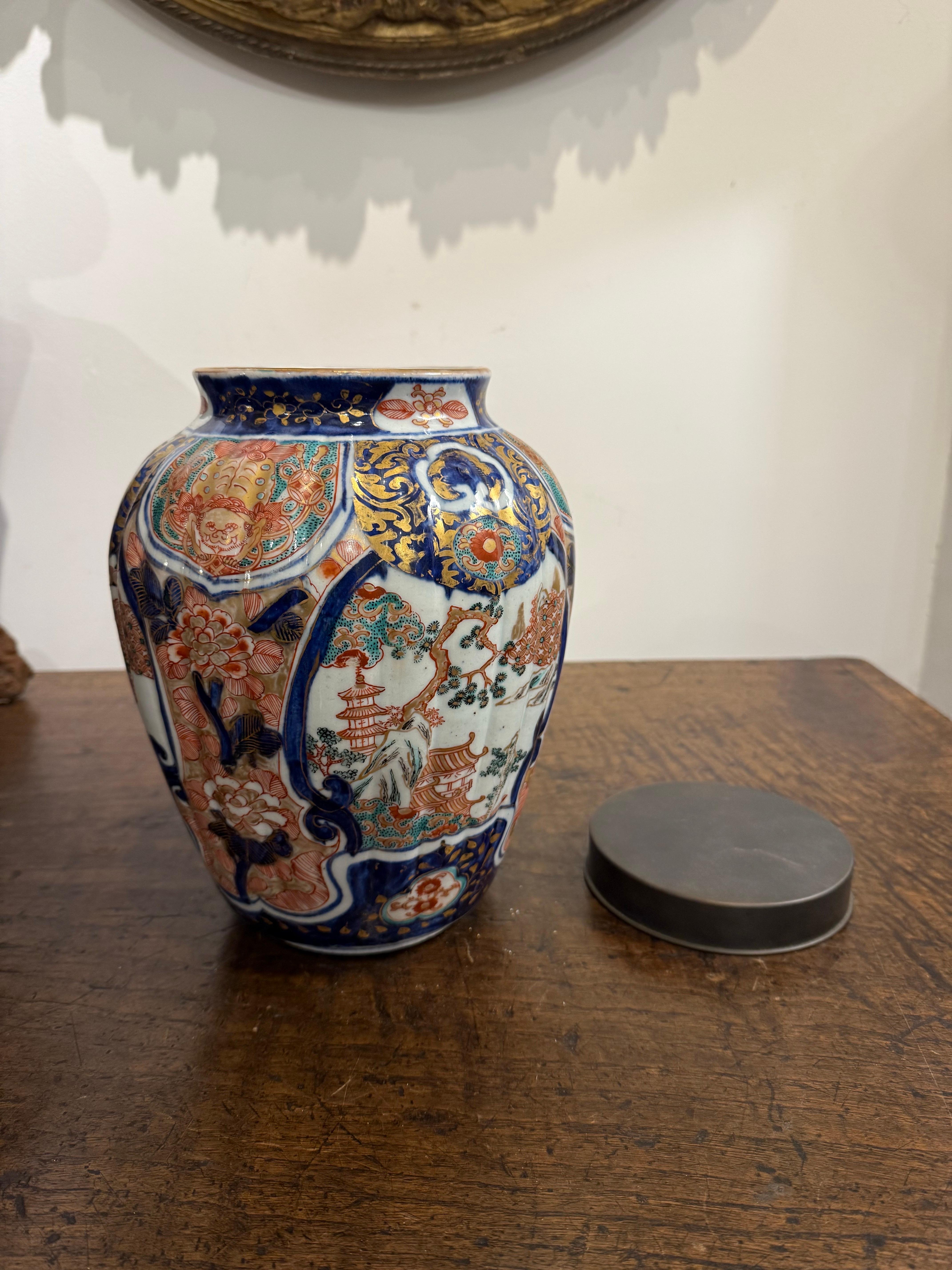 Porcelain A Japanese Fluted Imari Vase with Mark and Metal Cover, 19th Century For Sale