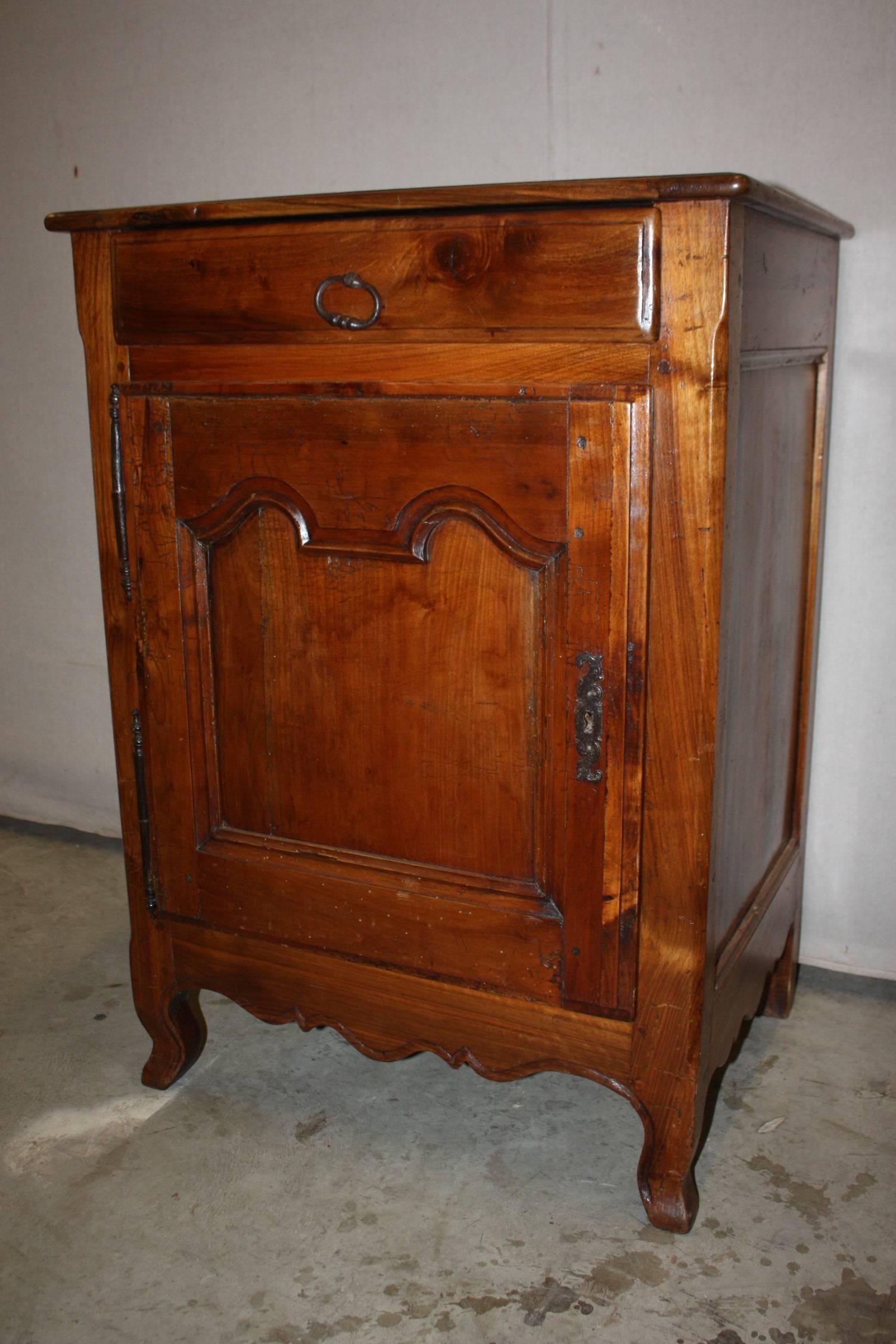 Antique French country Louis XV cabinet de confiture ‘jam holder’. Single drawer solid walnut with iron hardware and a beautiful carved apron.