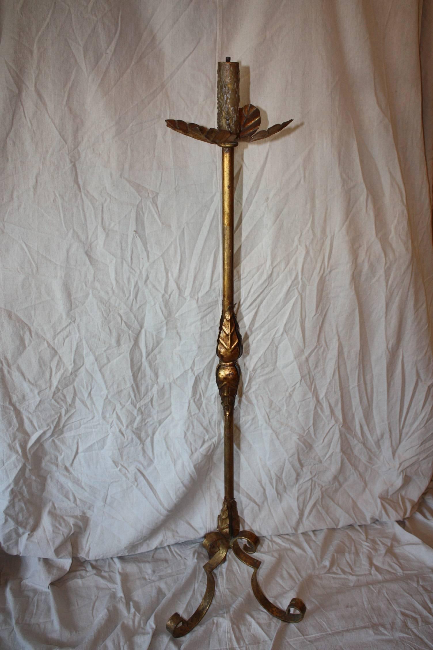 Early 20th century gilded iron standing lamp with beautiful lines and detail. This can be wired for no additional cost. It is 59