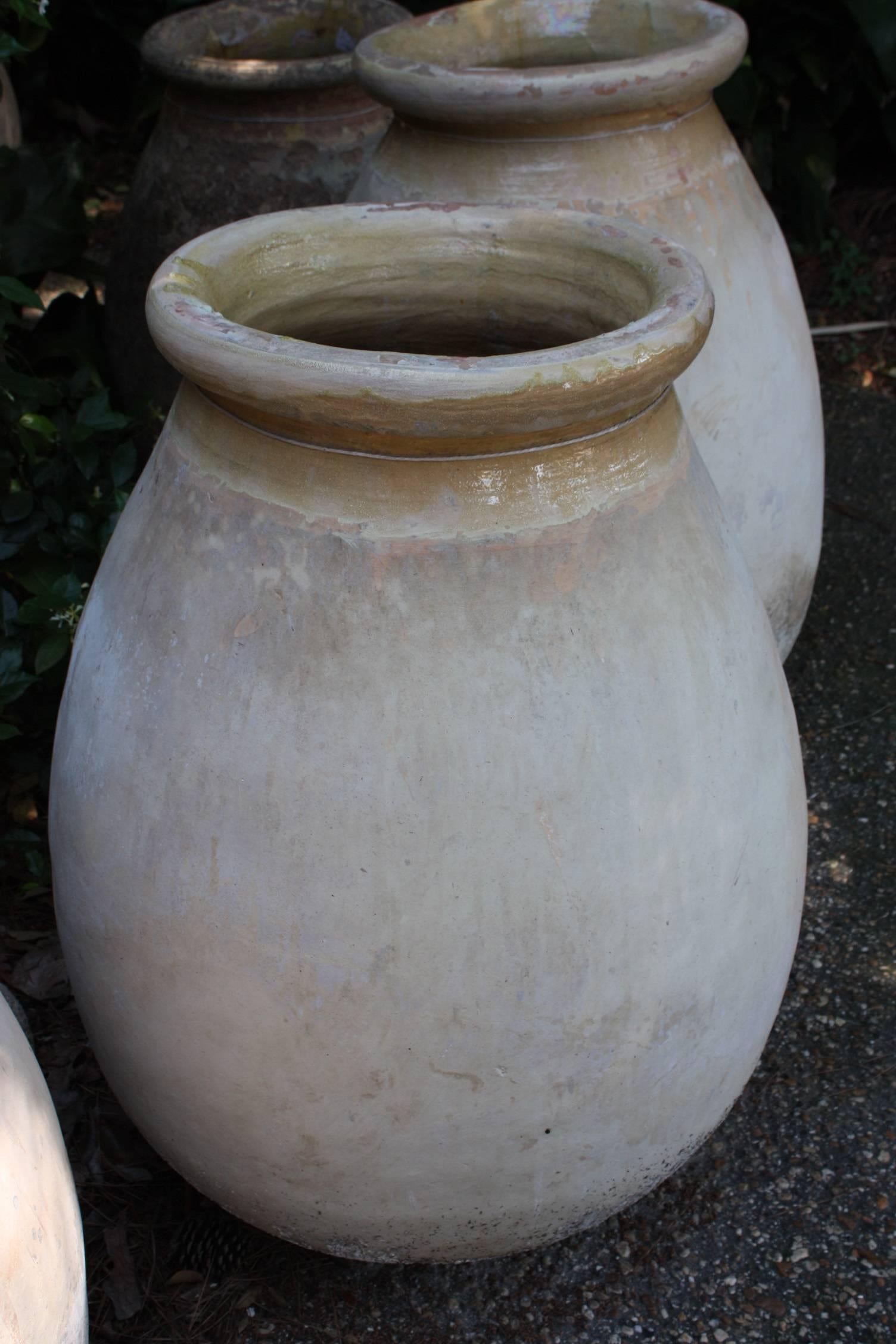 Early 19th century French terracotta Biot olive jar with an attractive shape, patina and yellow glazing.