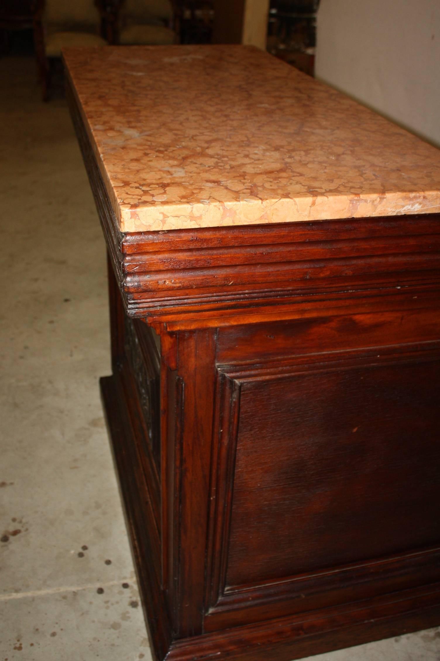 Marble top L shaped bar. The depth of the front part is 19.75