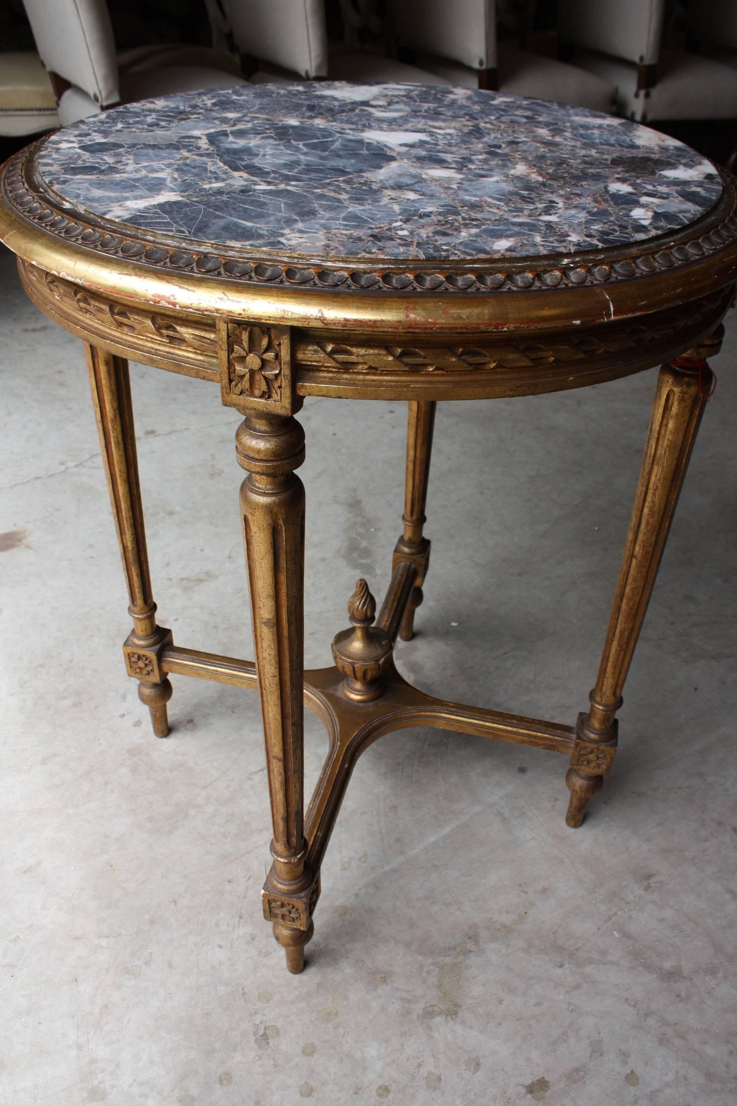 Louis XVI round gueridon in gilded wood with marble top.