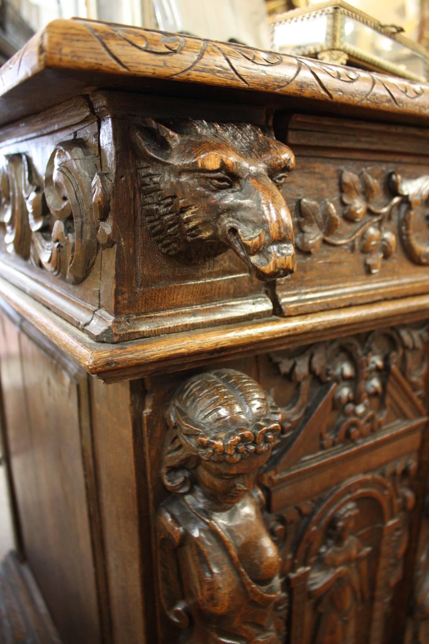 An exceptional Louis XIII carved chest handcrafted of solid oak with a single drawer above three doors.