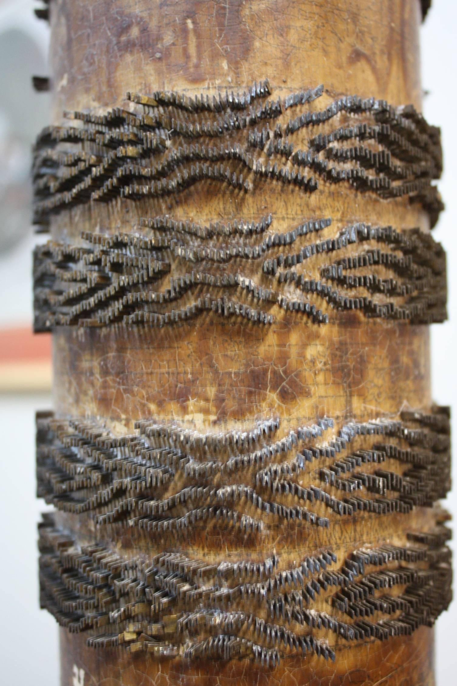 Each roller is a unique, one of a kind, handmade machine part that was used to print wallpaper dating back to 1839. The design was carved and milled with brass into the roller by a skilled artisan. Original ink marks still visible. Wired for the