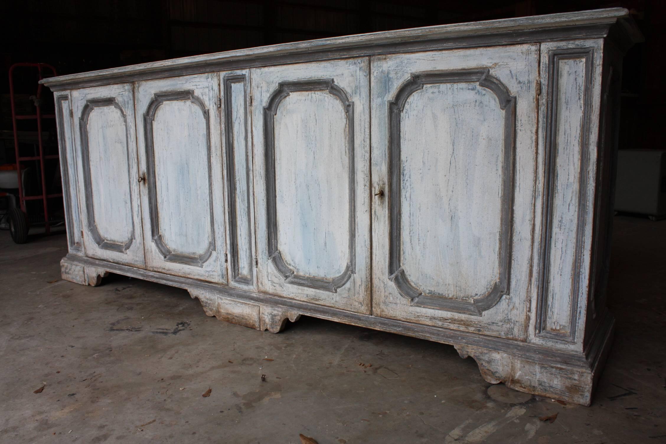 Italian painted buffet with clean lines and beautifully carved beveled edge details and two separate storage compartments.