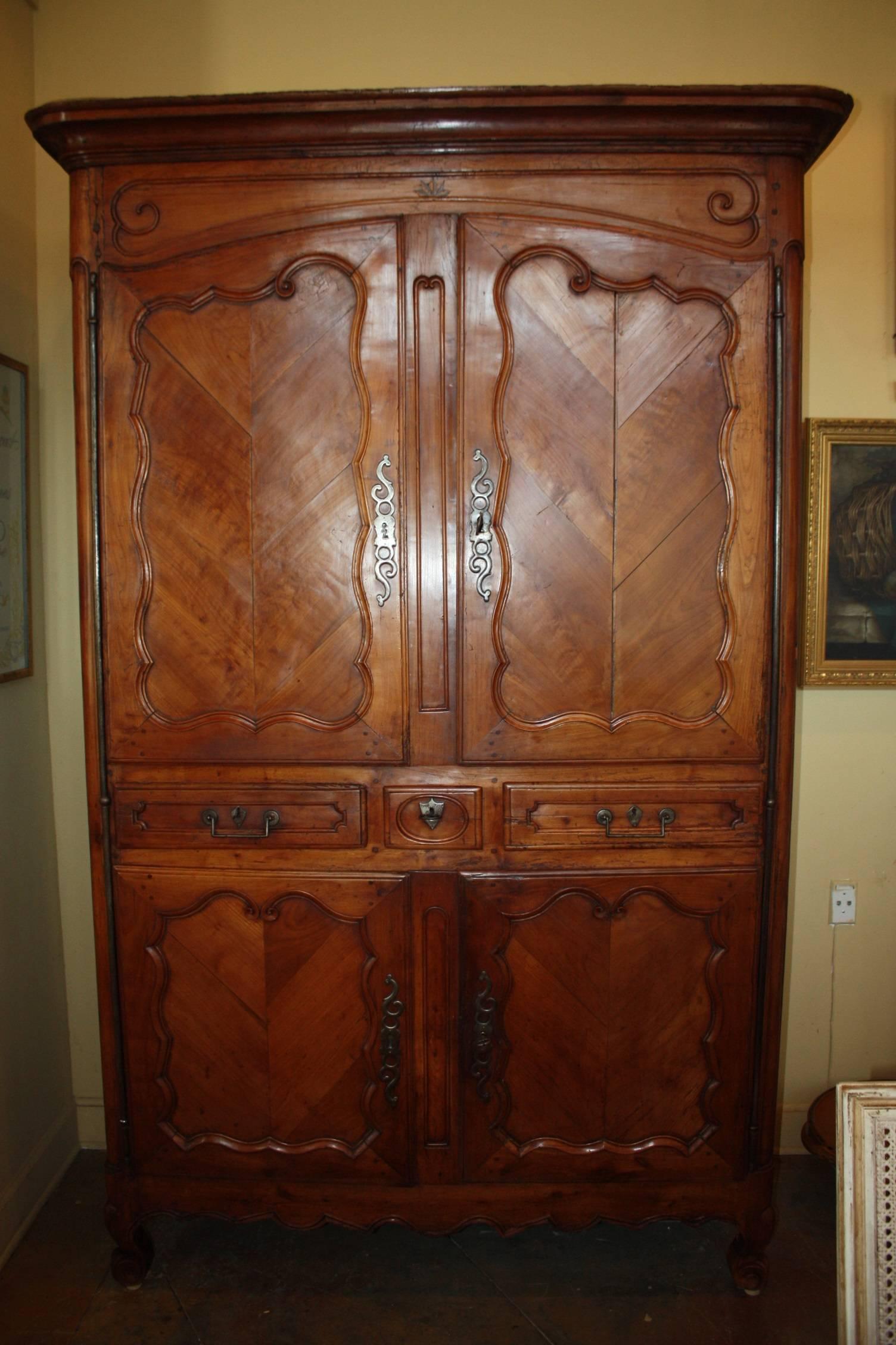 This magnificent, tall cherry armoire 