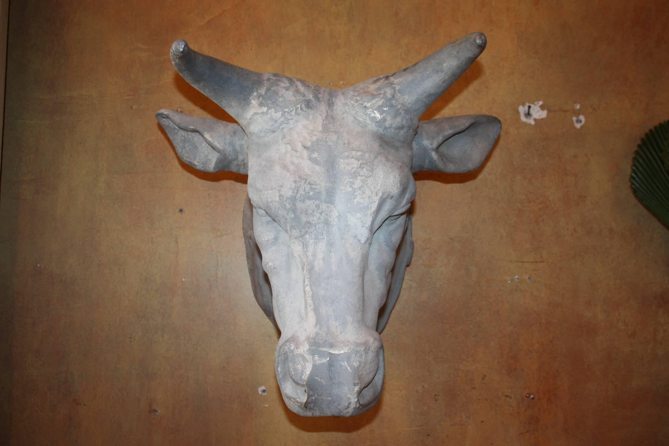 Metal bulls heads, French, circa 1900. Originally used as trade signs for butcheries.