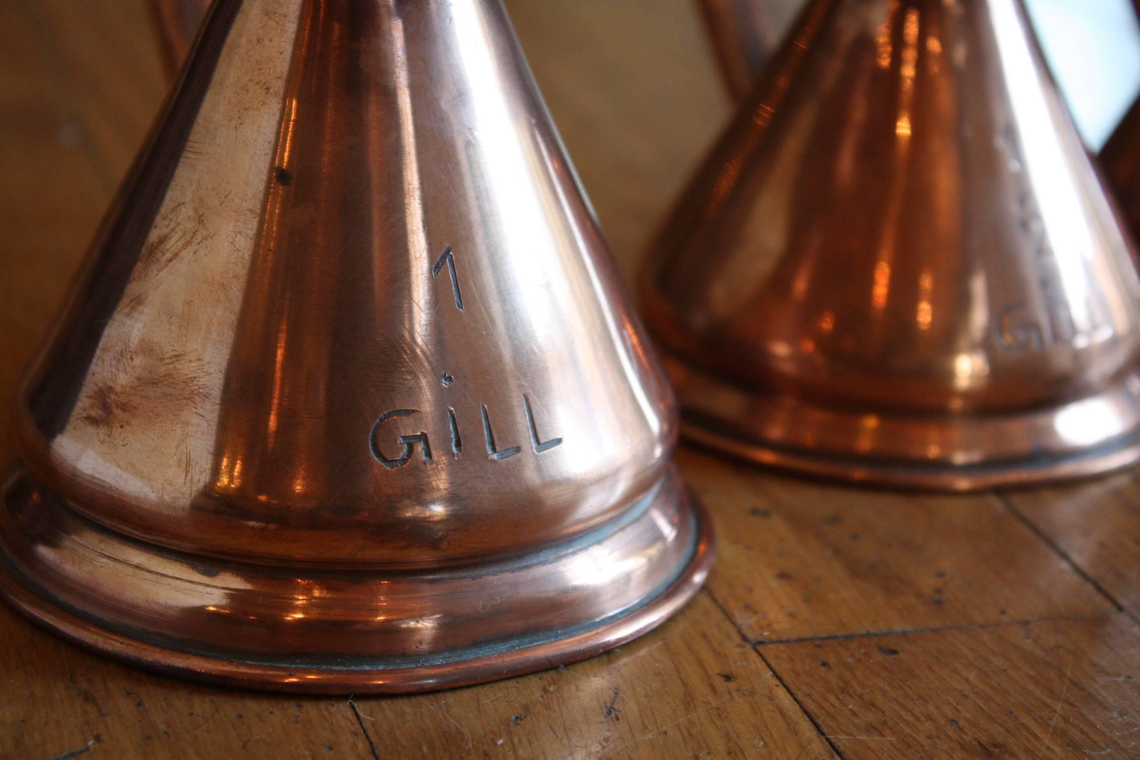 Matched Set of Four Small 19th Century Copper Pitchers with Stamps 1