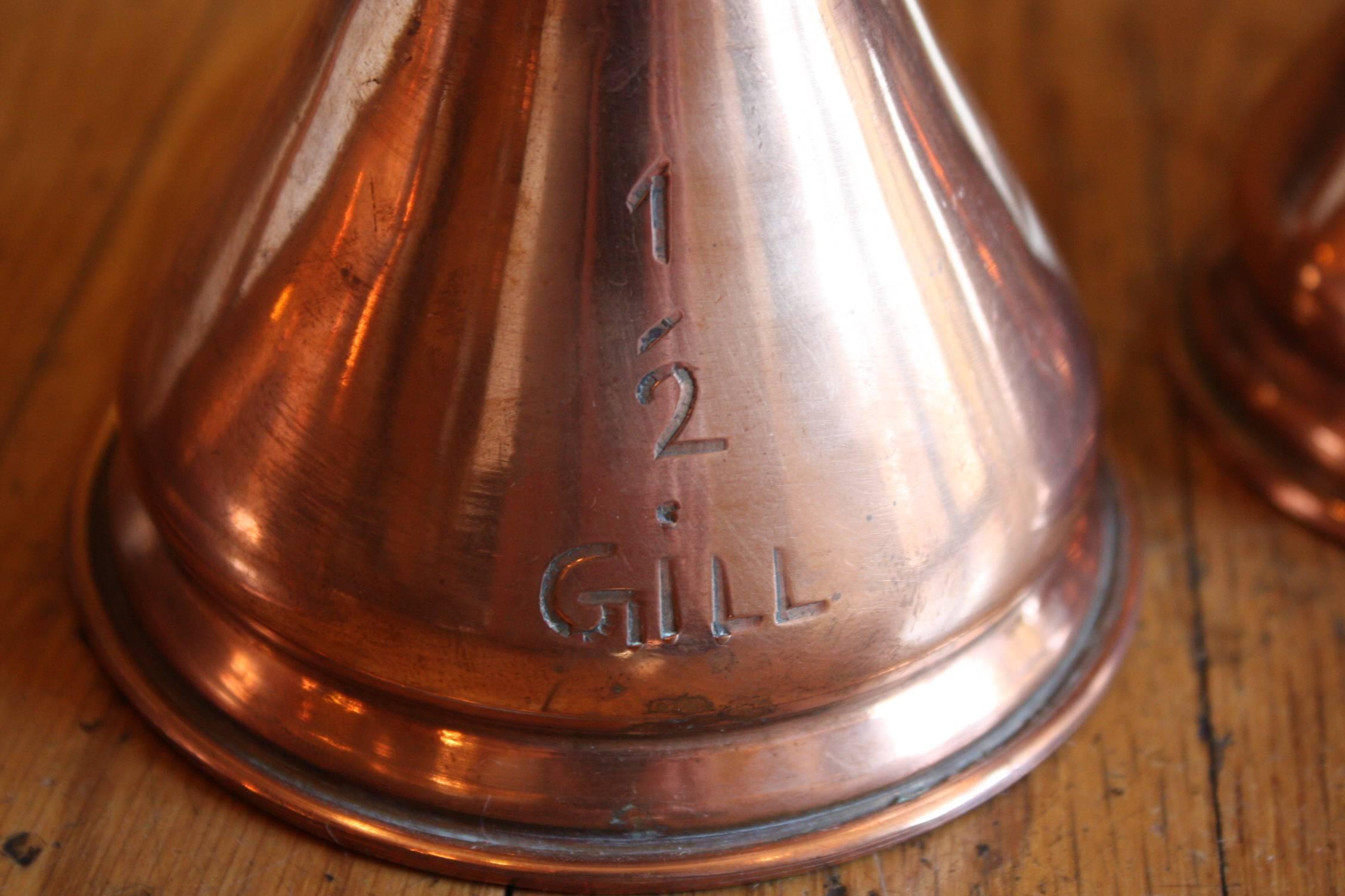 Matched Set of Four Small 19th Century Copper Pitchers with Stamps 2