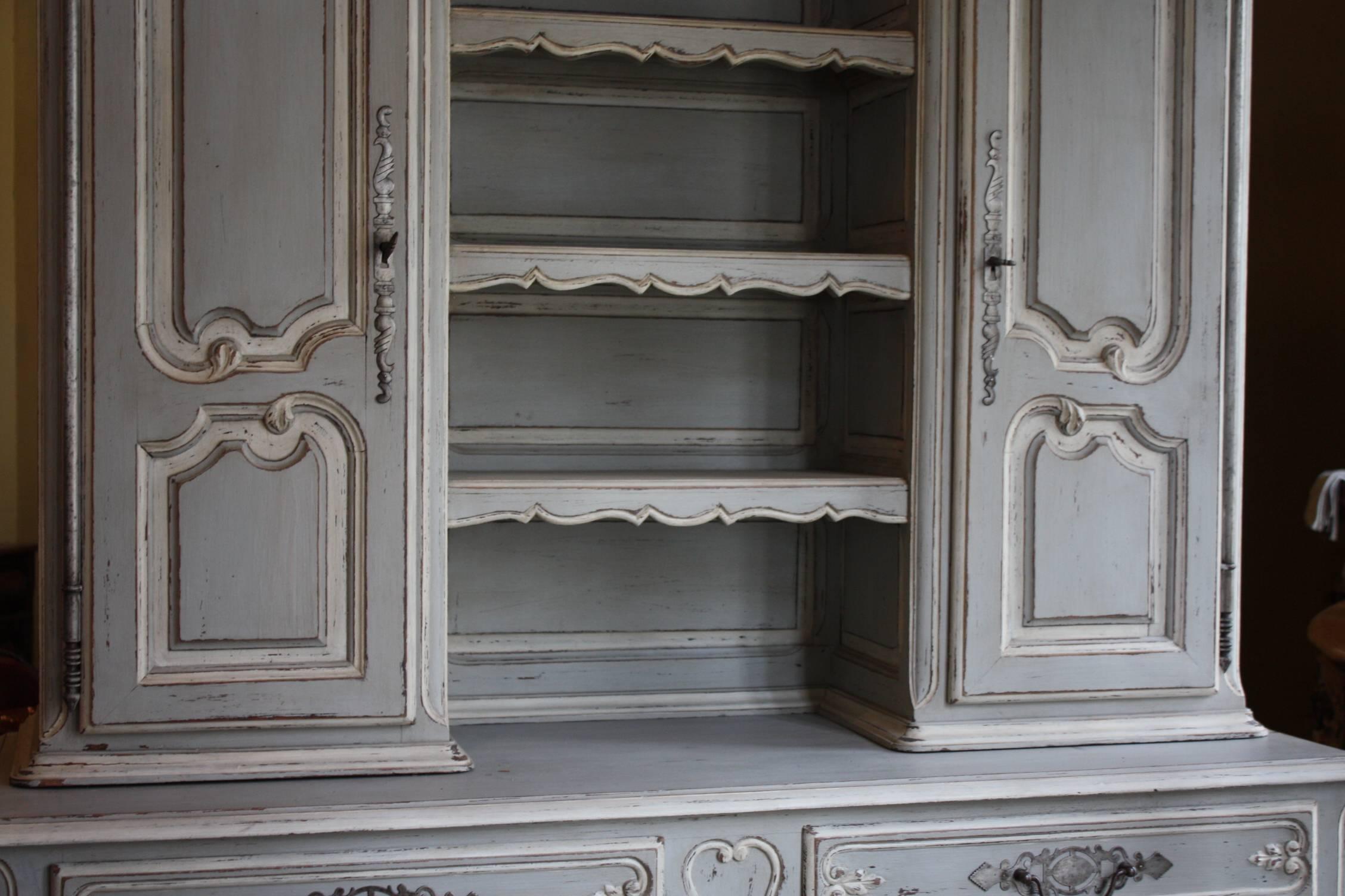 Beautiful vaisselier from the north of Normandy painted French blue/grey and white. This vaisselier has two plate racks. The space between the two shelves is 9 inches high and can hold 9