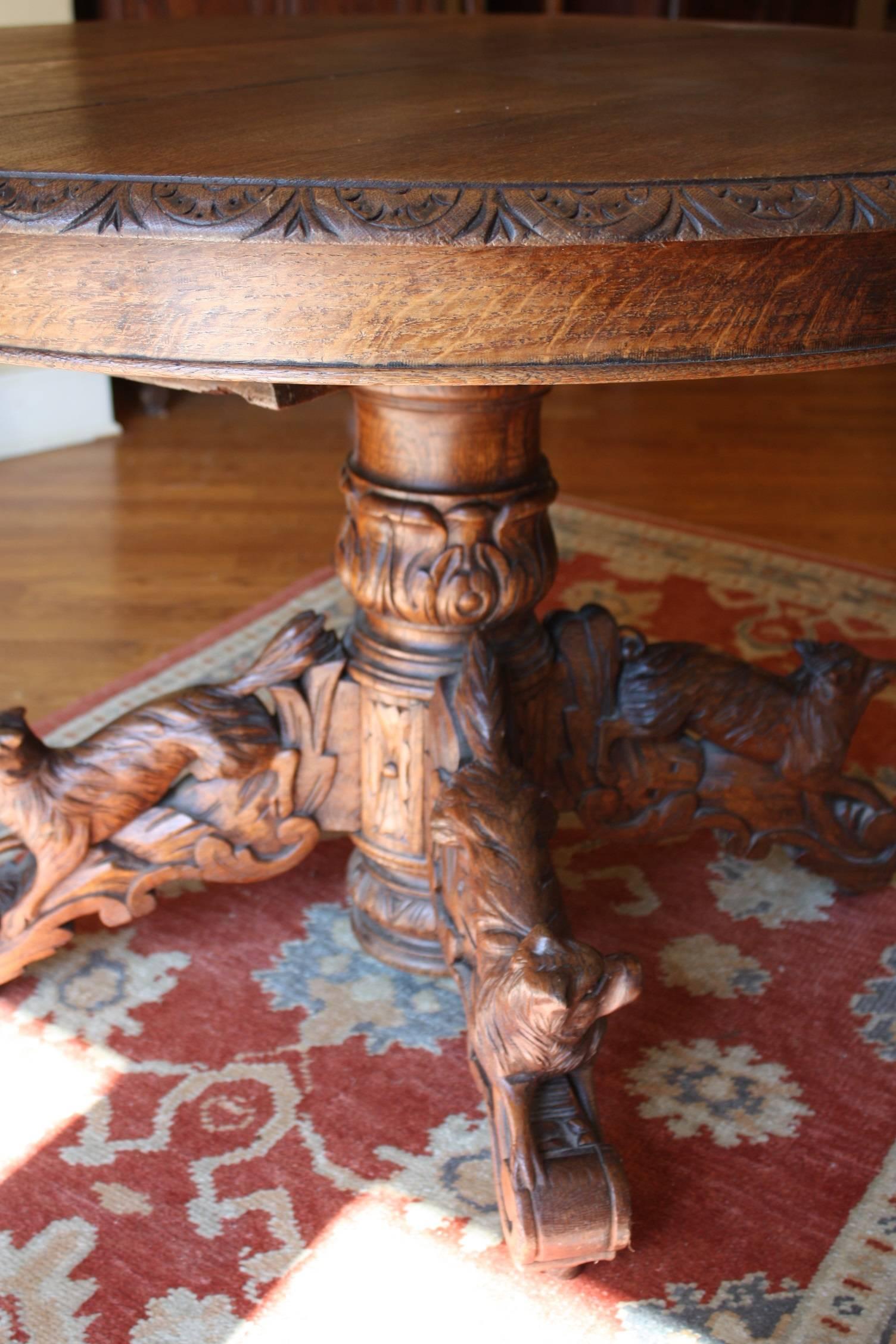 An antique French oak hunt table, circa 1870. These tables were designed originally for hunting lodges in the 19th century and make fantastic standalone decorative pieces or small kitchen tables. This table had leaves at one time but were misplaced