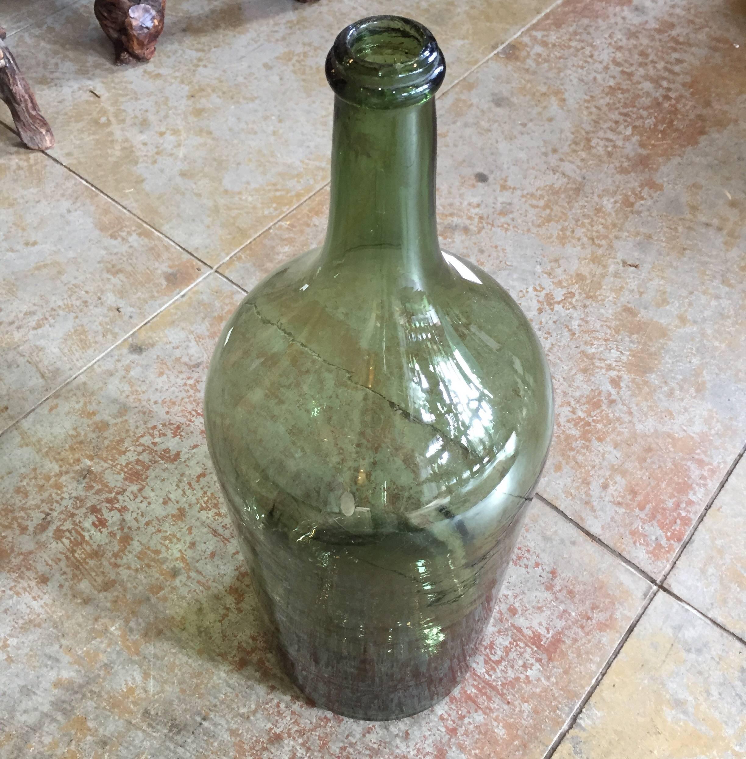 Antique French handblown glass wine or spirit bottle. We have more available of different sizes.