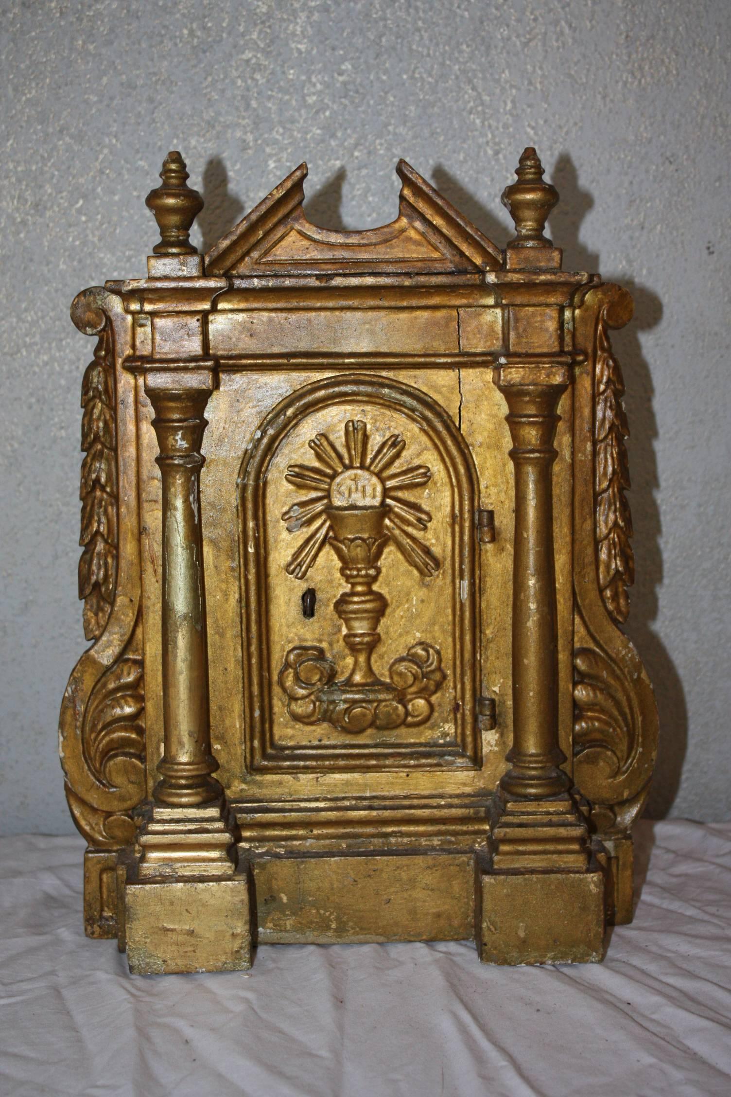 This is a very attractive small French tabernacle that dates to the 19th Century.  The carvings are very nice.  There is a key but the lock no longer works.  