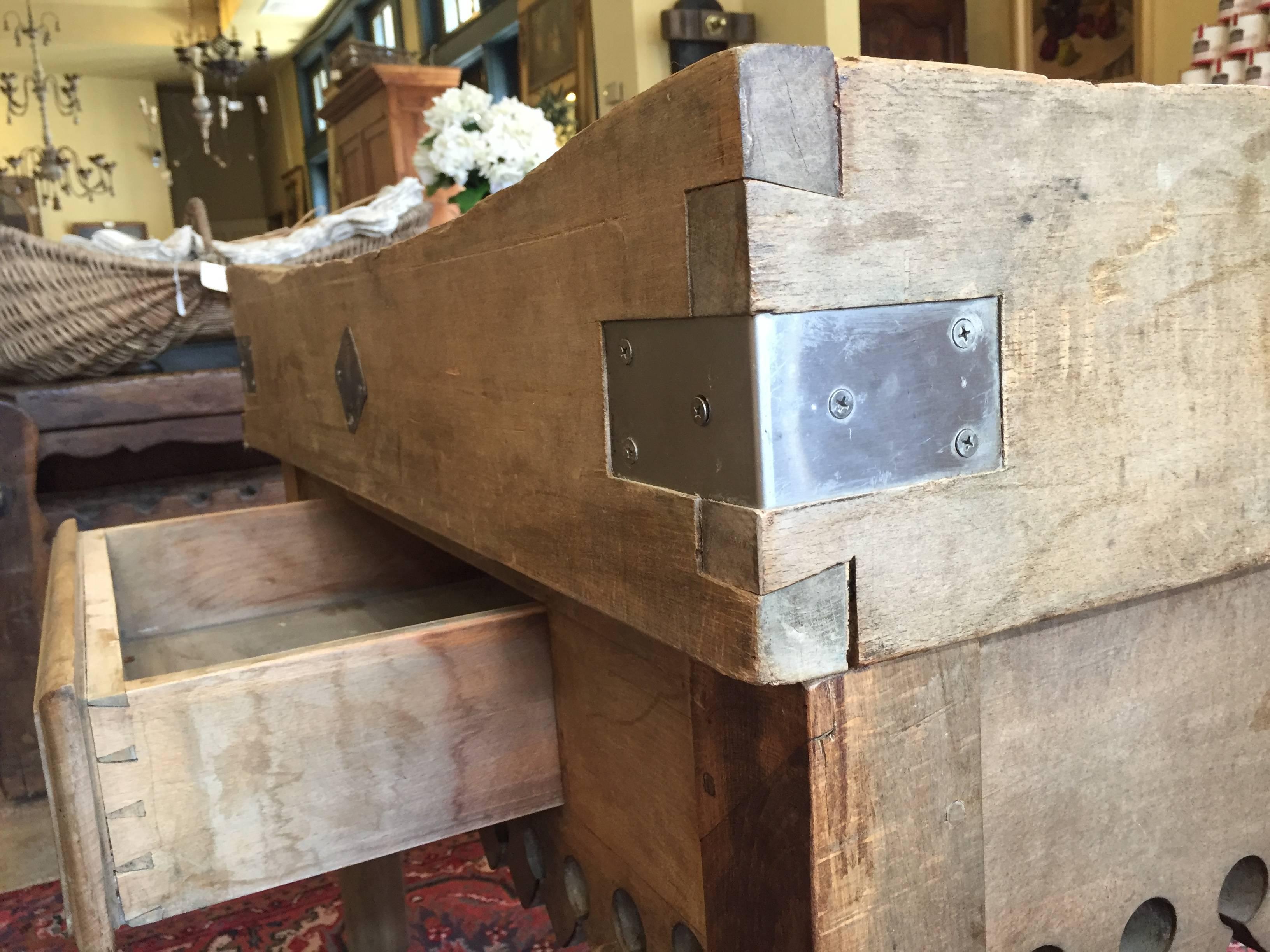 Beautiful 19th century butcher block from France with carved scalloped apron and a single drawer. This would make an excellent kitchen island.