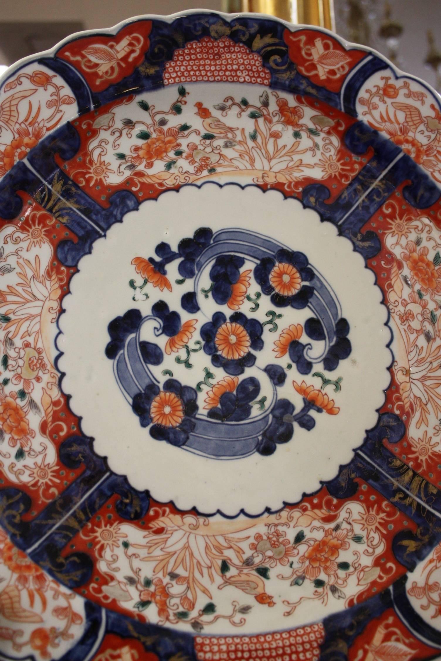 Large collection of Imari plates and platters.