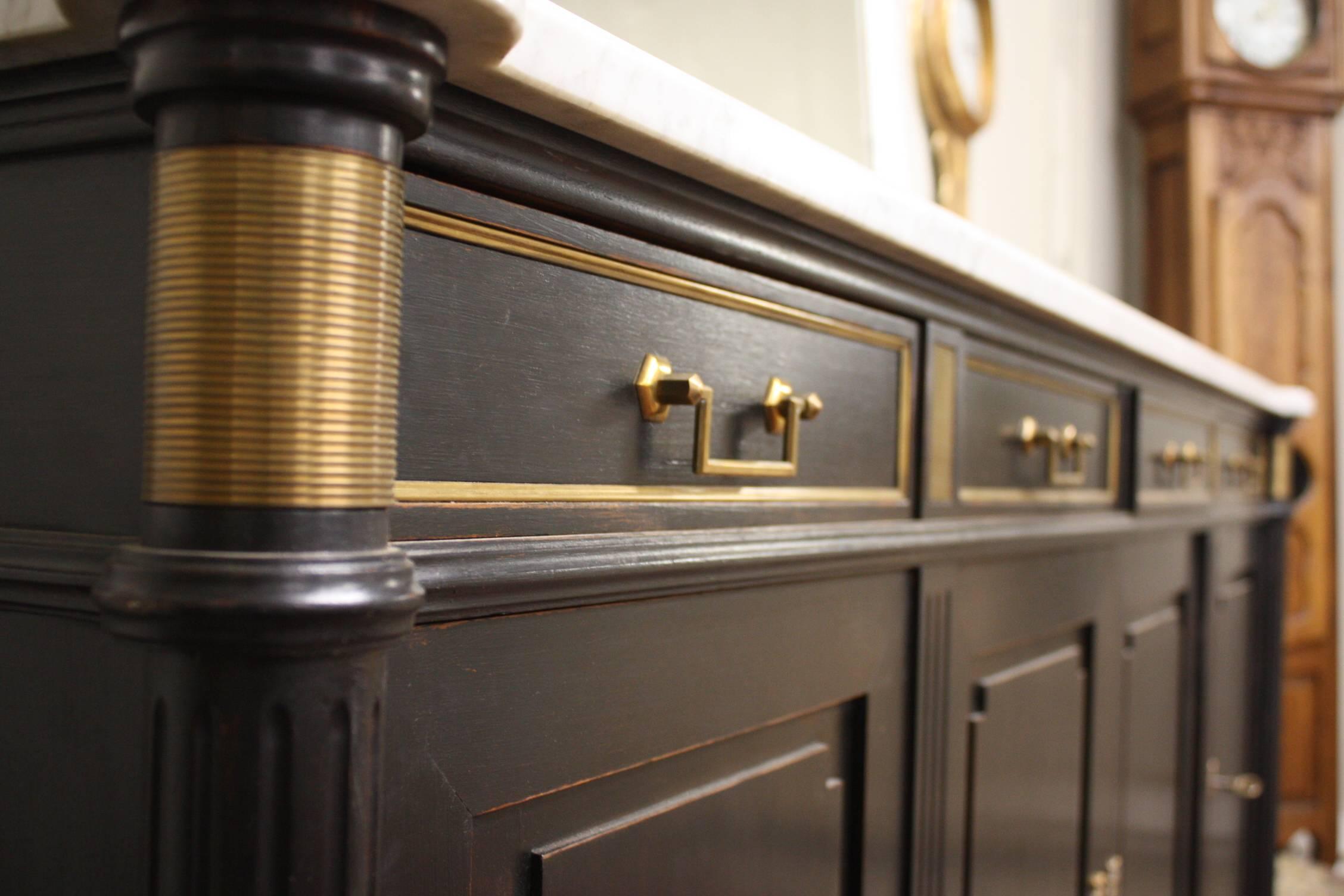 French Louis XVI buffet in a traditional ebonized finish with an exquisite white with gray veining marble top.