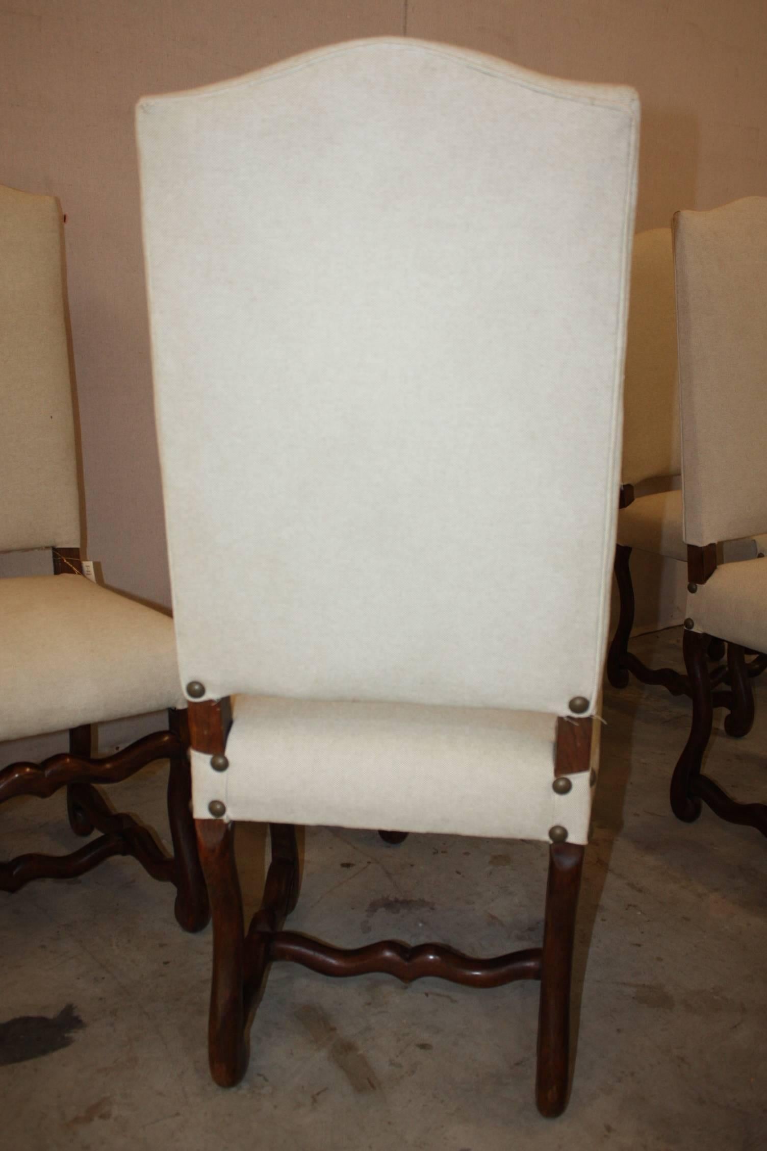 Set of six Os de Mouton oak side chairs newly upholstered in textured linen.