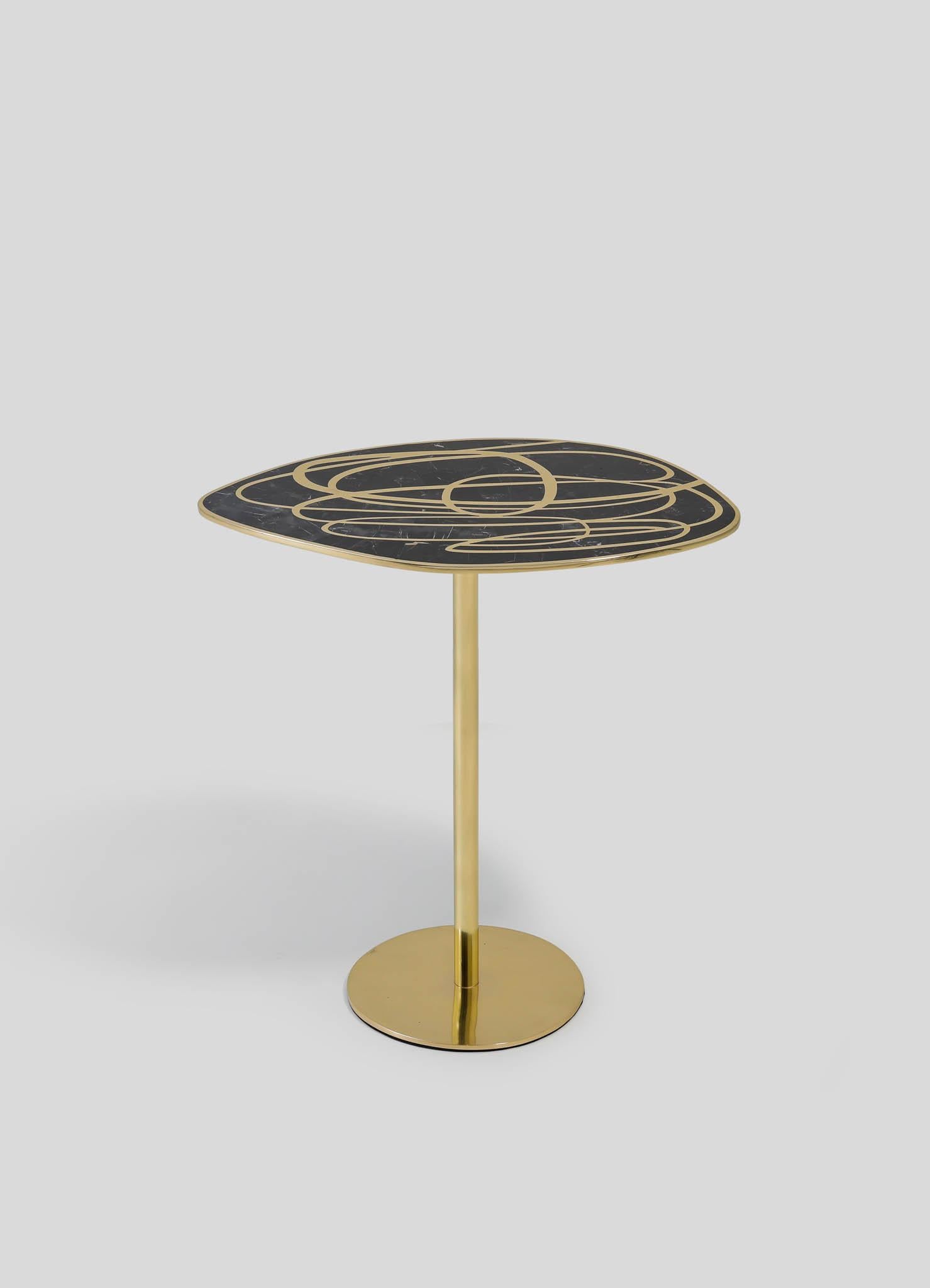 Chita Side Table in Brass & Semi Precious Stone, Viya by Vikram Goyal

Poetic patterns conspire to weave an enchanting tapestry, a lyrical reinterpretation of Kolam-the ancient ritual of adornment that graces the thresholds of Indian homes.