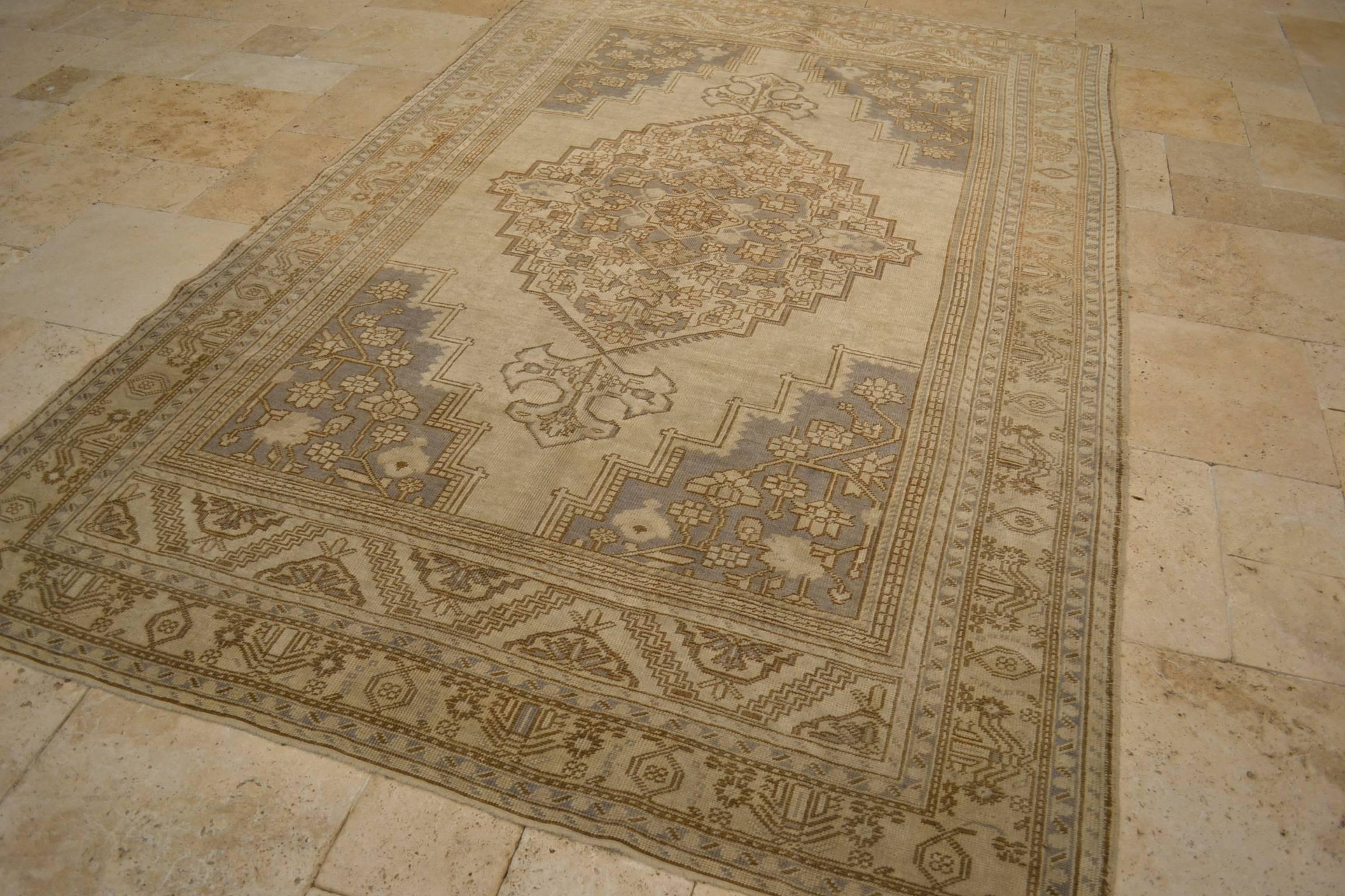 Vintage Anatolian Oushak rug, hand-knotted, wool.